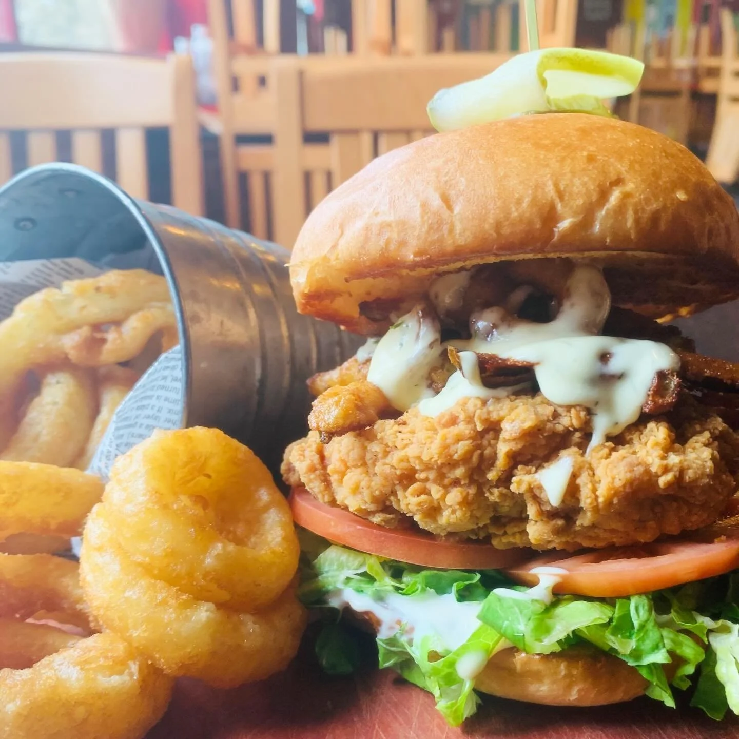 Behold, 
The Big Dill Chicken
Hand breaded, crispy chicken breast, ranch, tomato, lettuce, crispy dill pickle &lsquo;fries&rsquo; (thin cut pickle spears, lightly breaded and fries till golden) &amp; dill aioli on a premium brioche bun with our fan f
