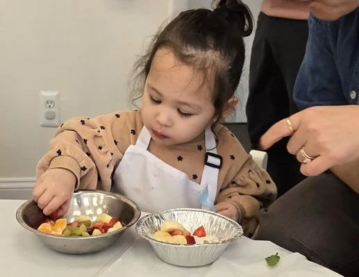 a kid eating fruit bowl