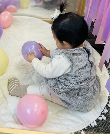Kid having fun with balloon