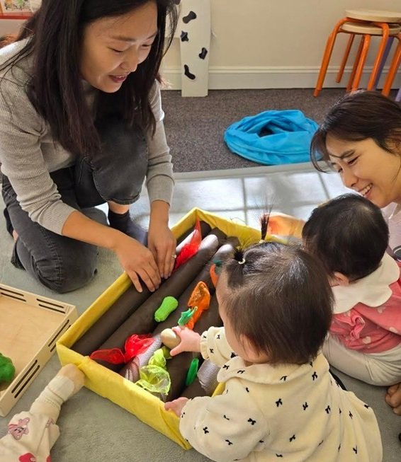 Kids playing with farm toy