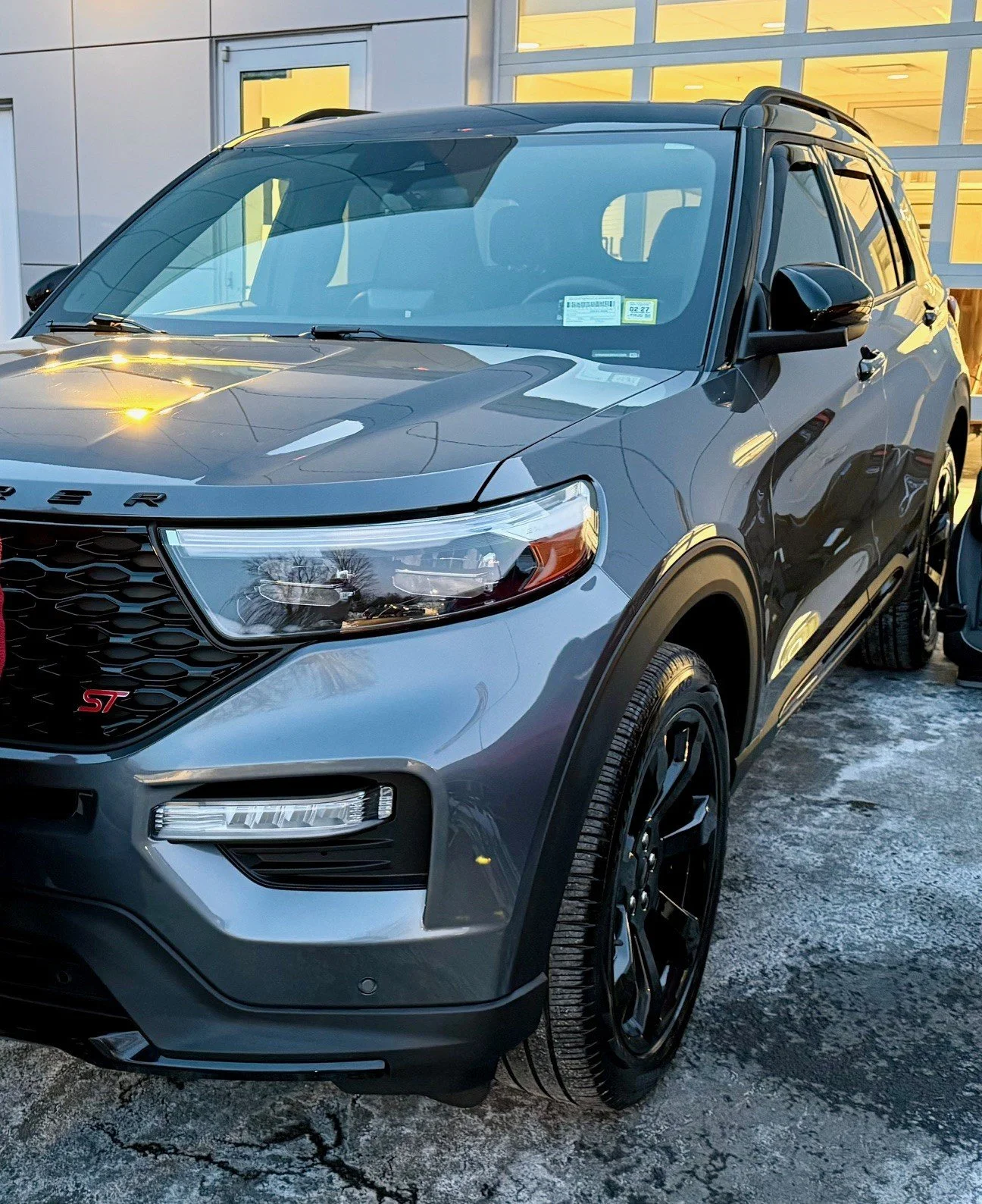A gray Ford SUV after a car wash detailing. Interior and Exterior of the car have been washed and detailed at a mobile location.