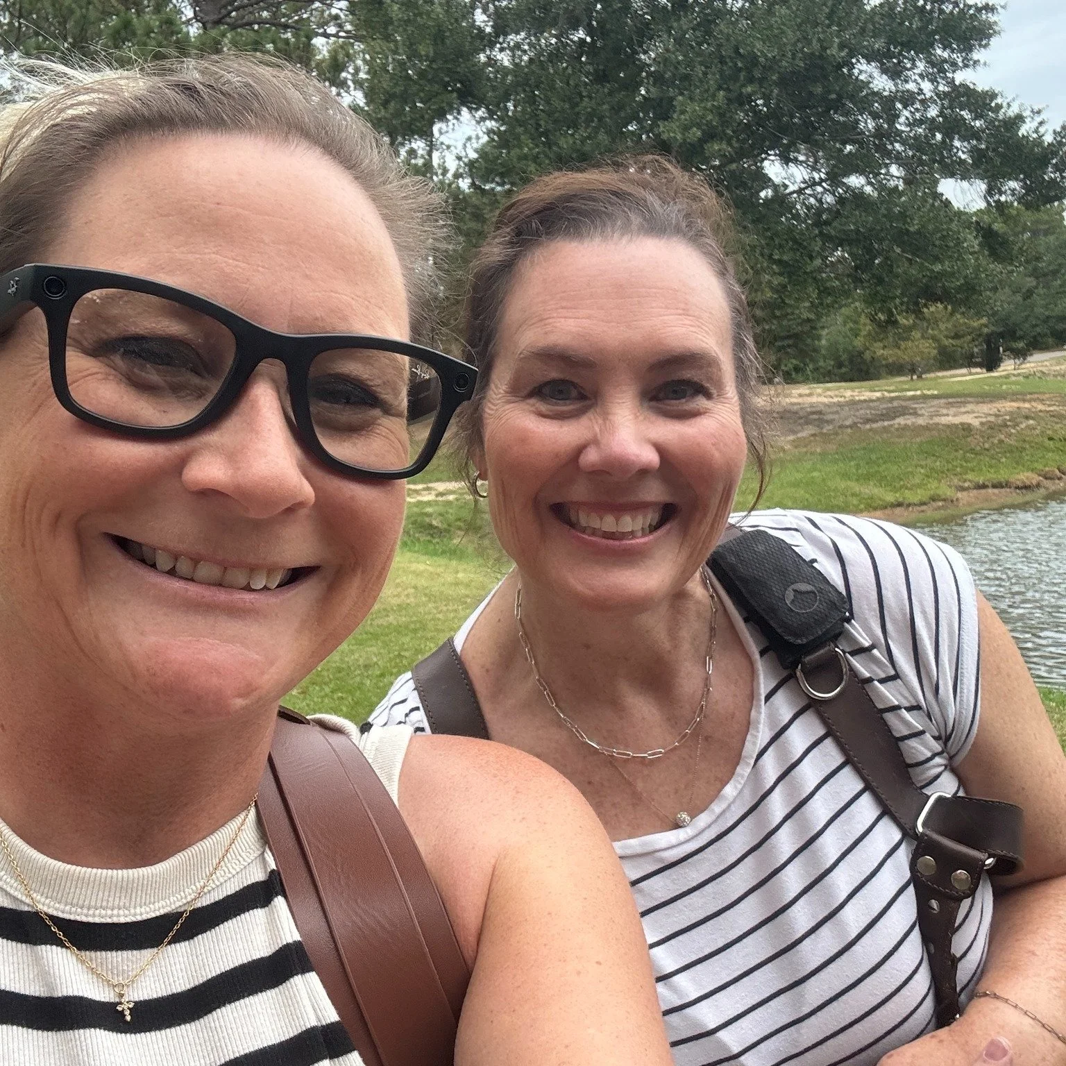We unknowingly matched at our wedding shoot this past weekend. Stripes and black pants, sneakers, brown camera harness, meta glasses, and a big smile.  We love our job! #behindthescenes #photography #GCCS #GrowYourBrand #weddingphotography #ootd
