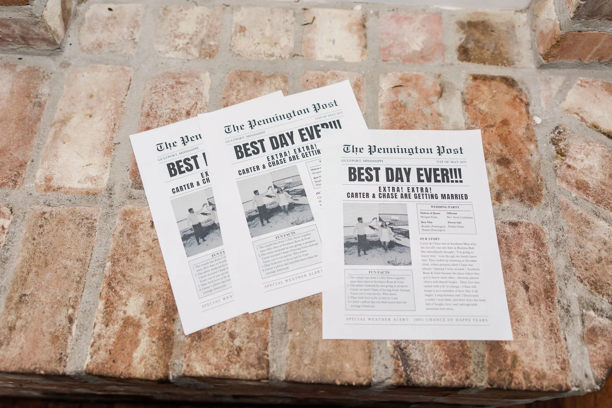 three-wedding-invitations-styled-as-newspapers-on-a-rustic-b.jpg