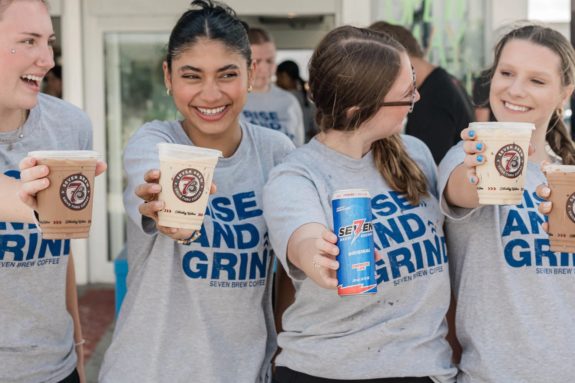 smiling-group-holding-seven-brew-coffee-and-energy-drinks-we.jpg