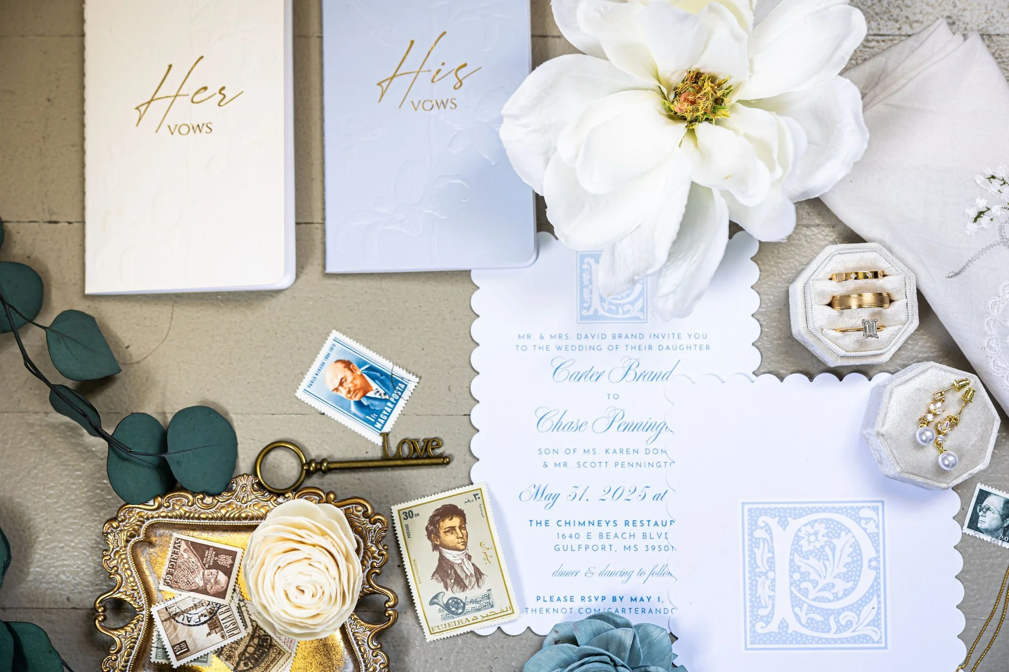 elegant-wedding-invitation-set-with-vow-books-floral-accents.jpg