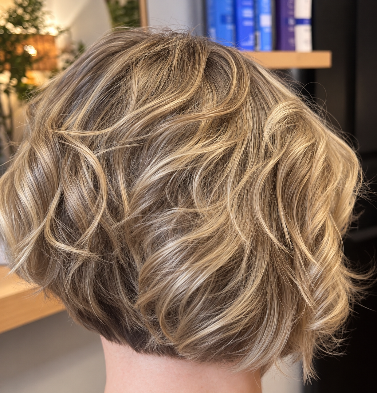 Precision graduated bob haircut with soft layers, natural movement, and subtle blonde highlights at Inwood Hair Studio, Manhattan NYC.