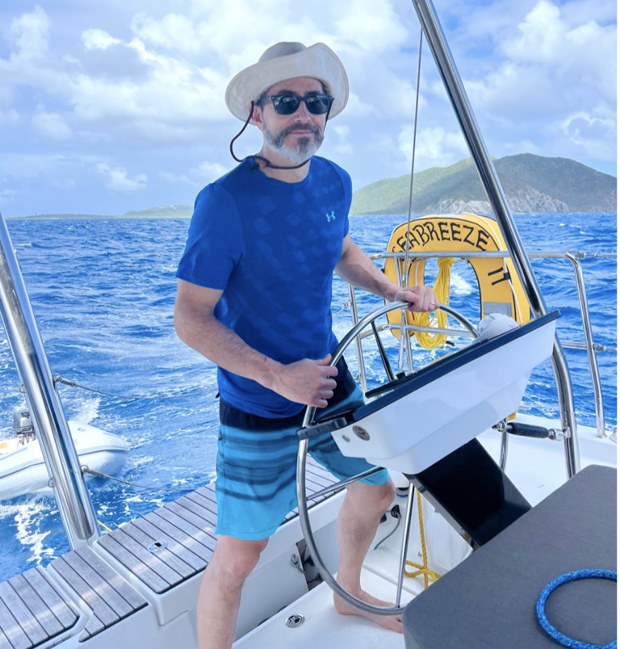 man learning to sail on private charter