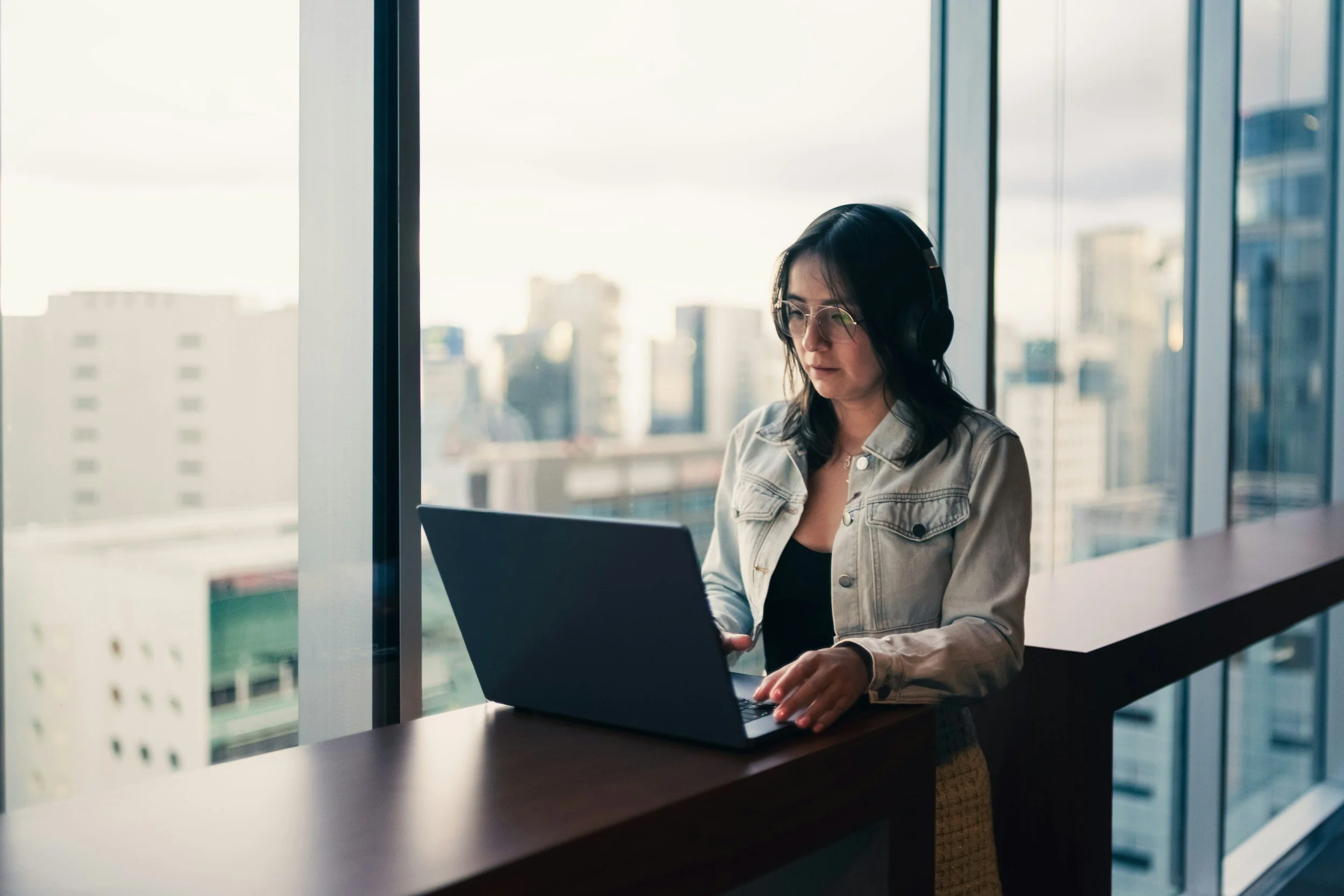 Insurance adjuster reviewing information on a laptop, where social media posts can become part of a claim file.