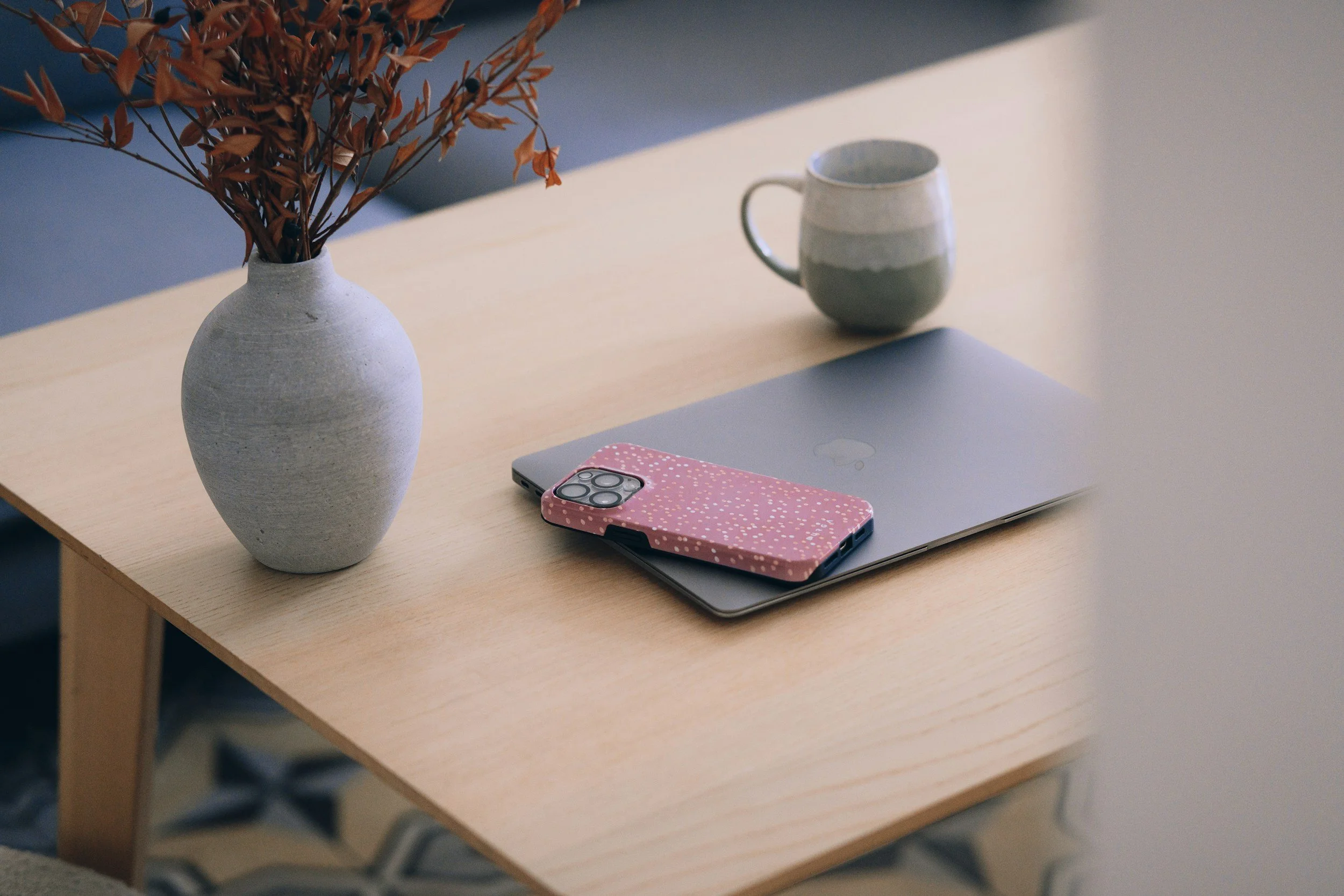 Phone set face down on a table, a reminder to stop posting while an injury claim is open.