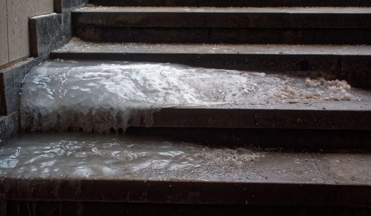 Ice forming on stairs and walkways during winter freeze and thaw cycles