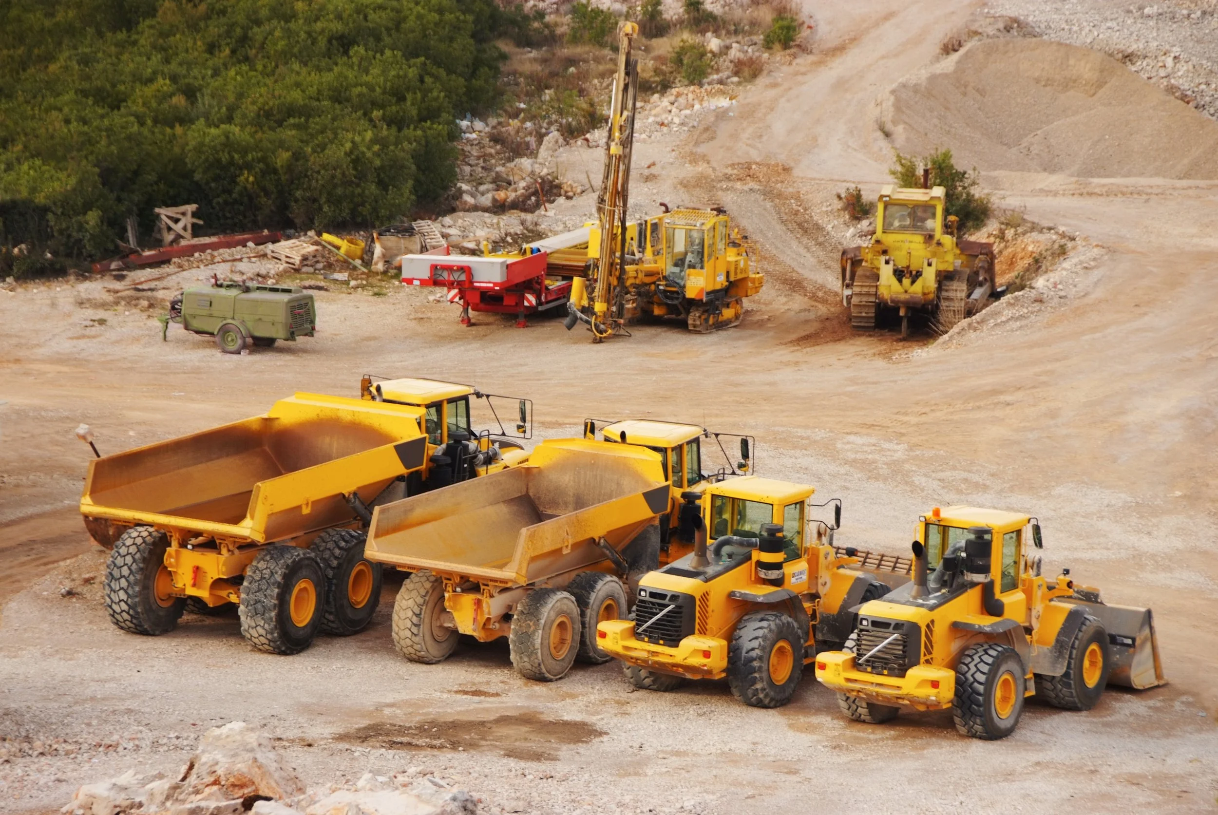 Heavy equipment operating on a job site where multiple contractors are working.