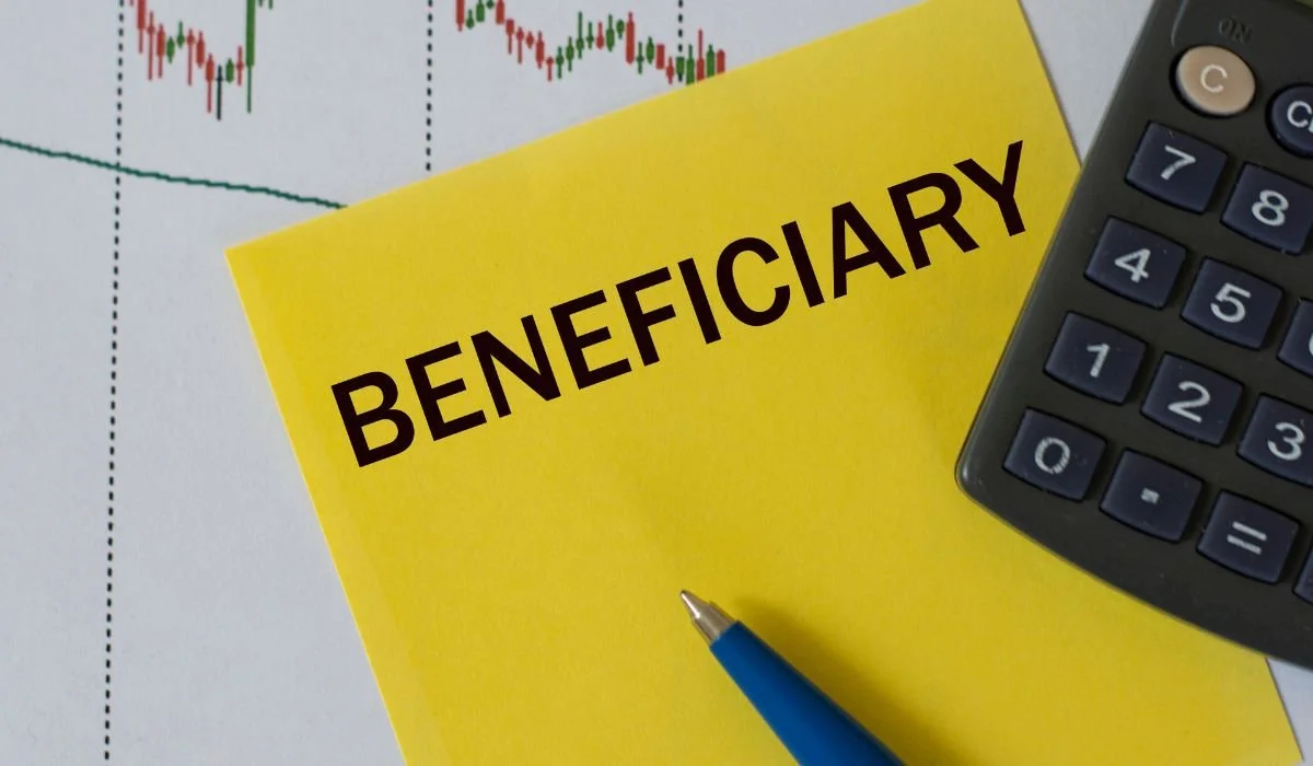 Beneficiary designation forms and retirement account paperwork being reviewed