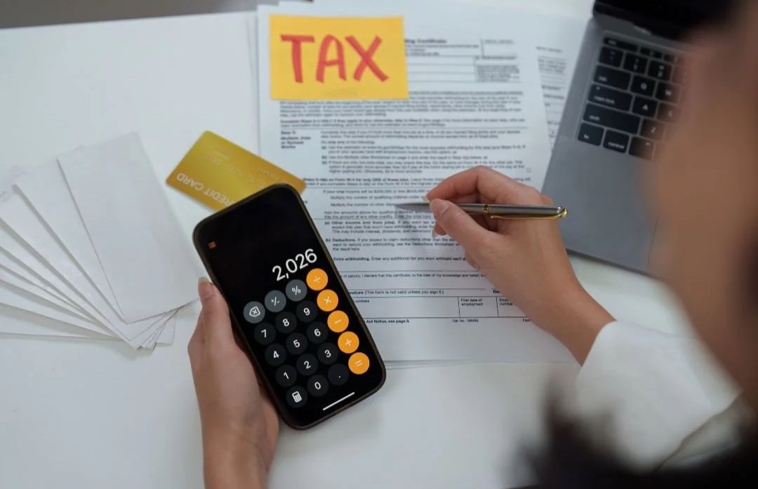 Pennsylvania entrepreneur preparing tax and employer account filings using the PA-100 form.