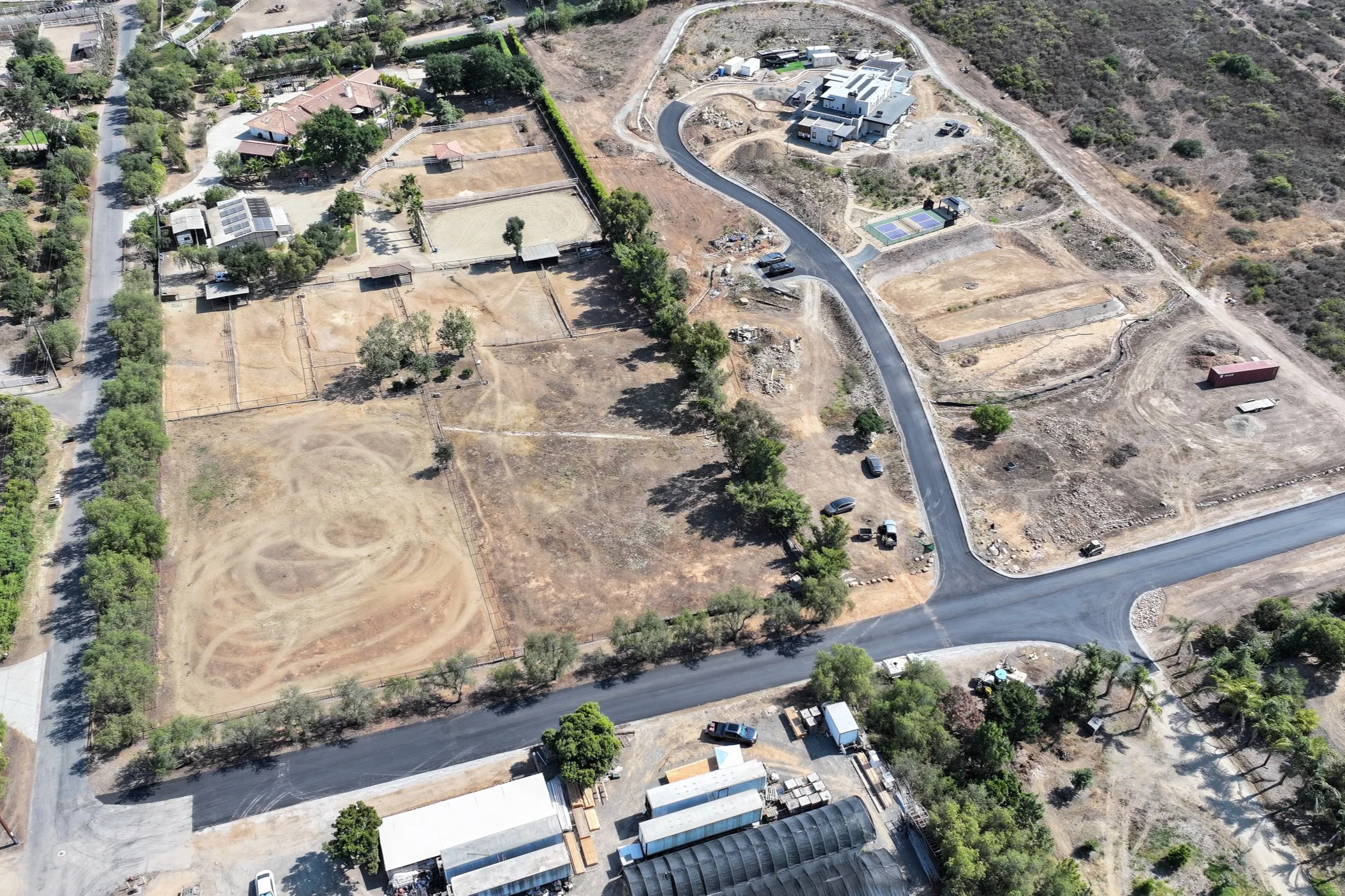 Driveway and street paving along Elfin Forest Road — precision grading and quality asphalt finish in a residential setting.
