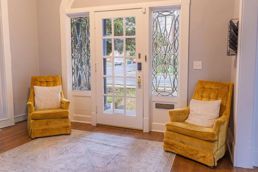 Ornate decorative windows in 1920s entry