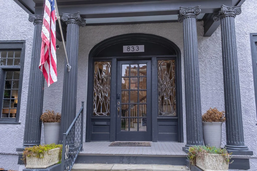 Grey 1920s entry with french door