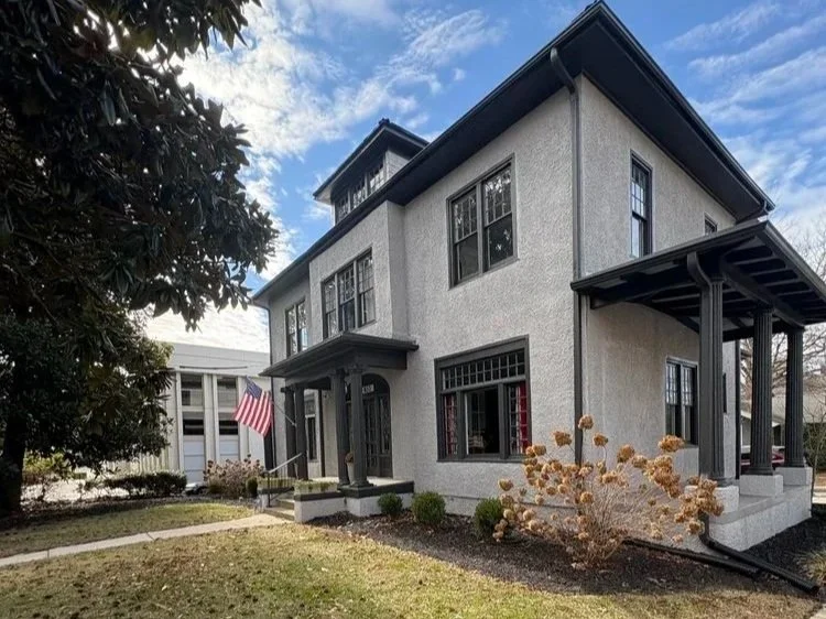 Grey 1920's home with beautiful windows