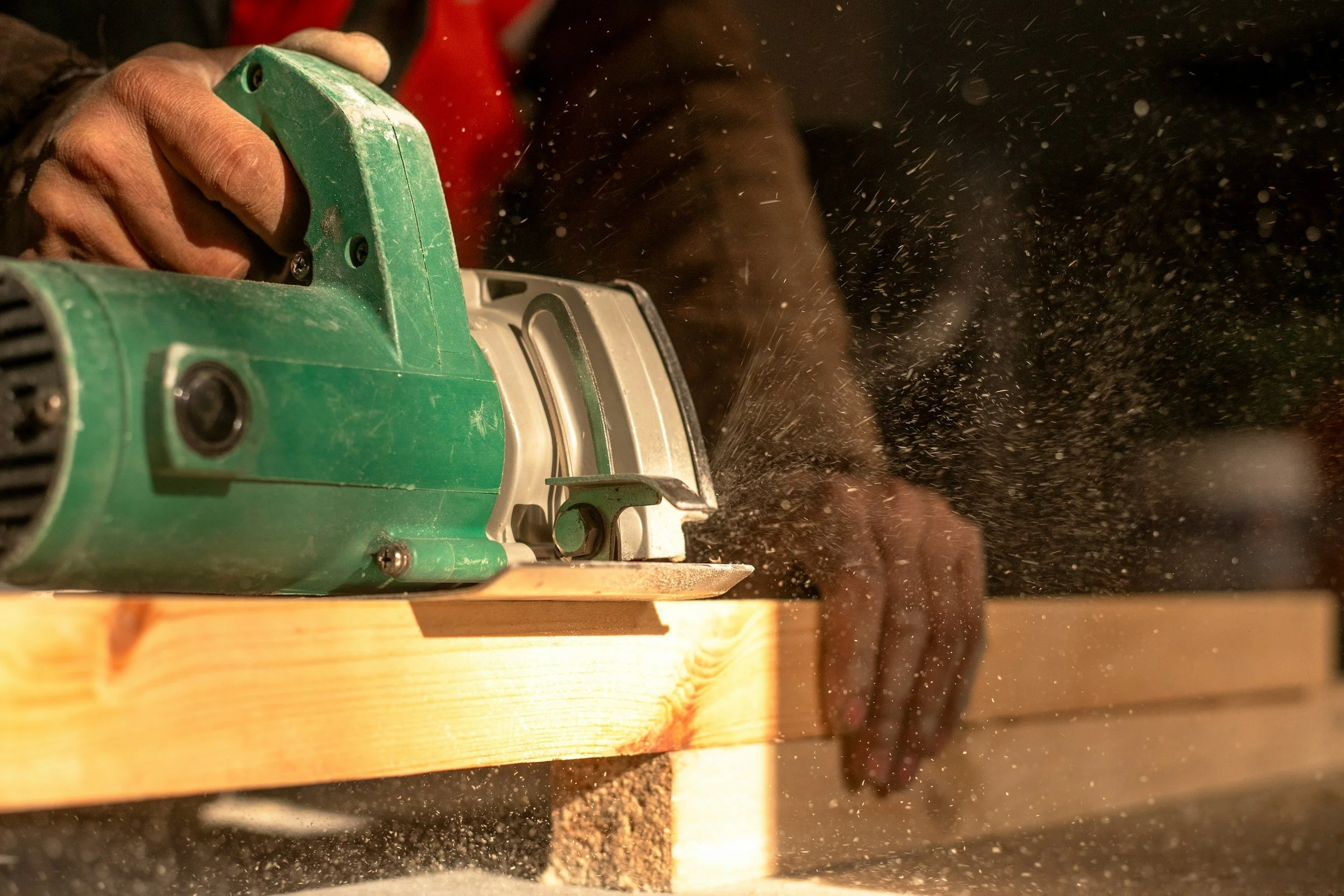 Home service professional using equipment on a residential job