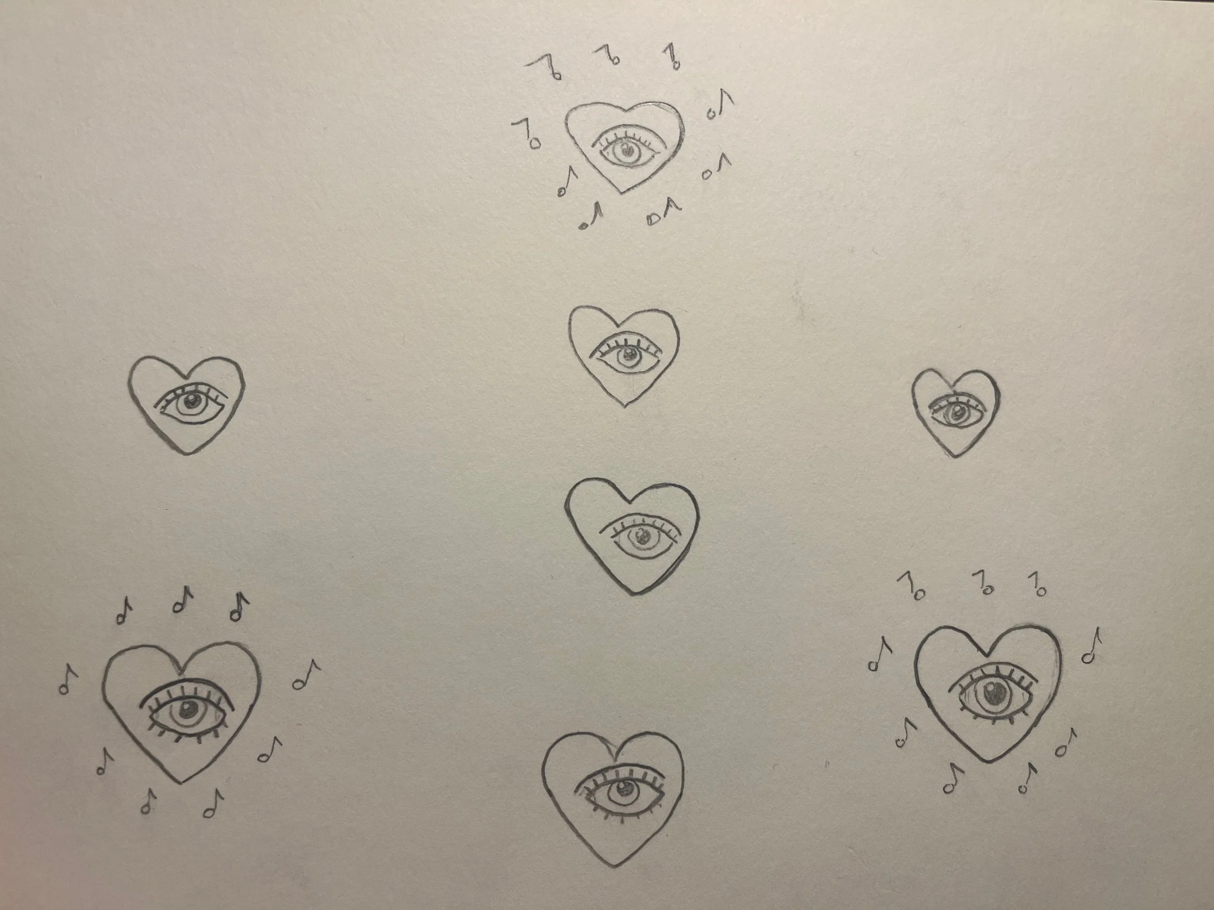 Hand-drawn doodles of hearts with eyes inside and musical notes around them, scattered on a blank background.