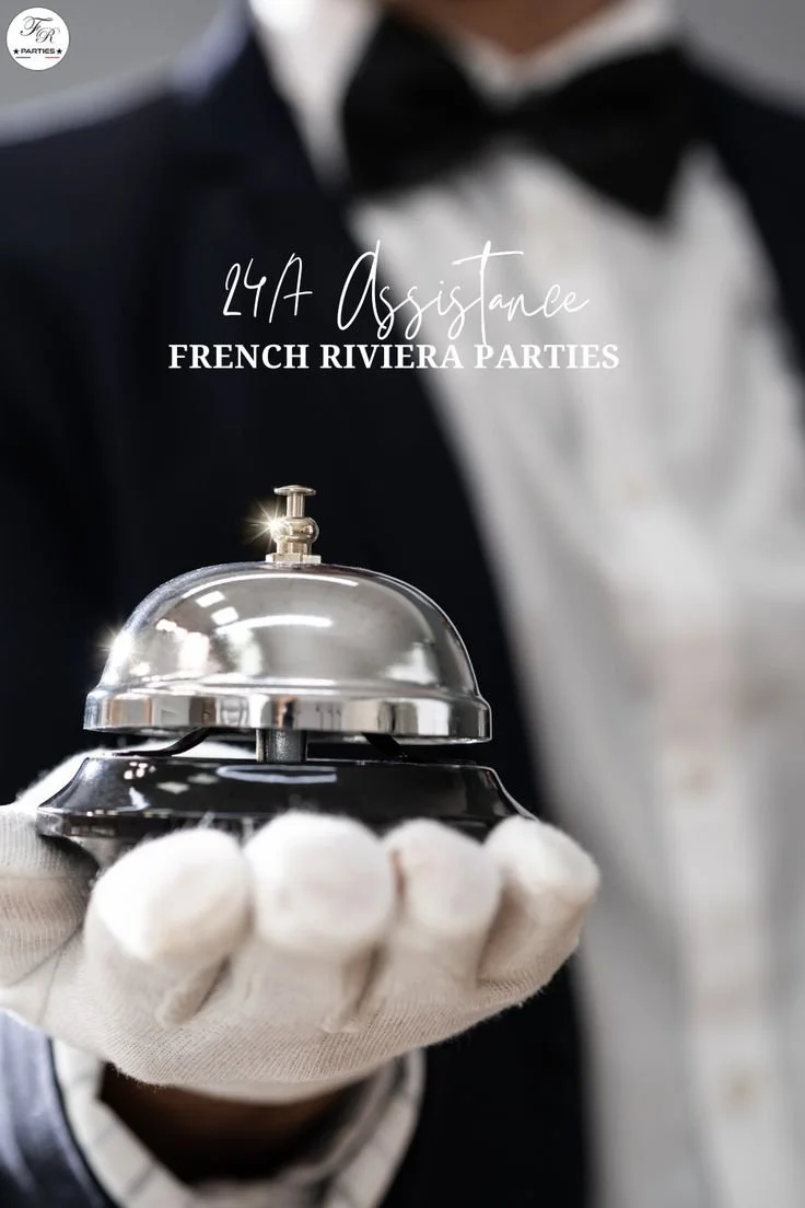 A person in a tuxedo and white gloves holding a service bell with a shiny silver top, promoting French Riviera parties.