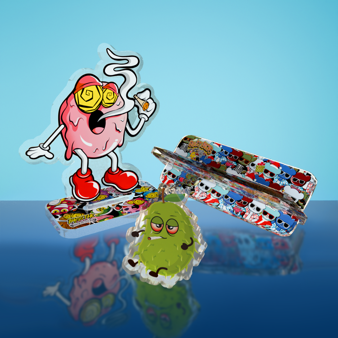 Branded acrylic figurine, acrylic keychains, and a collapsible tray used for custom merchandise, promotional products, and retail accessories.