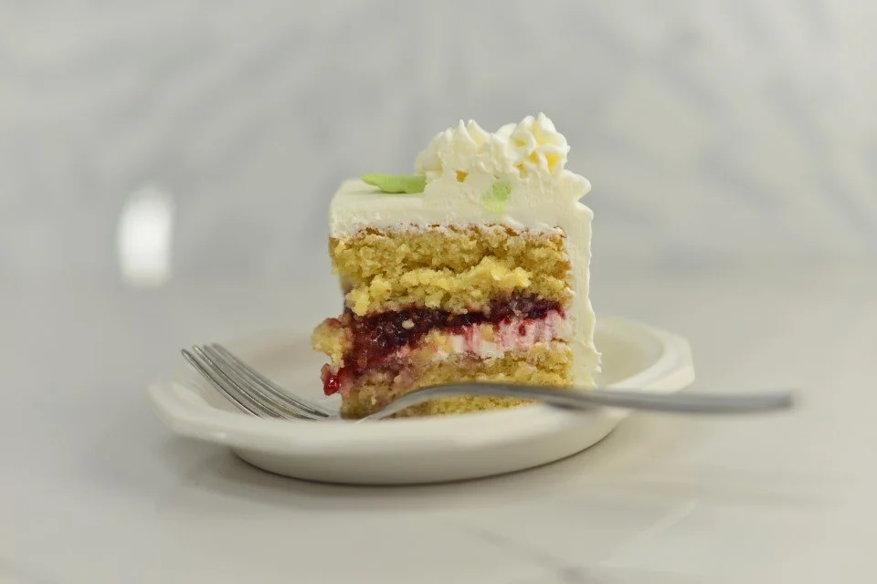 Slice of hot milk cake with raspberry filling.jpg