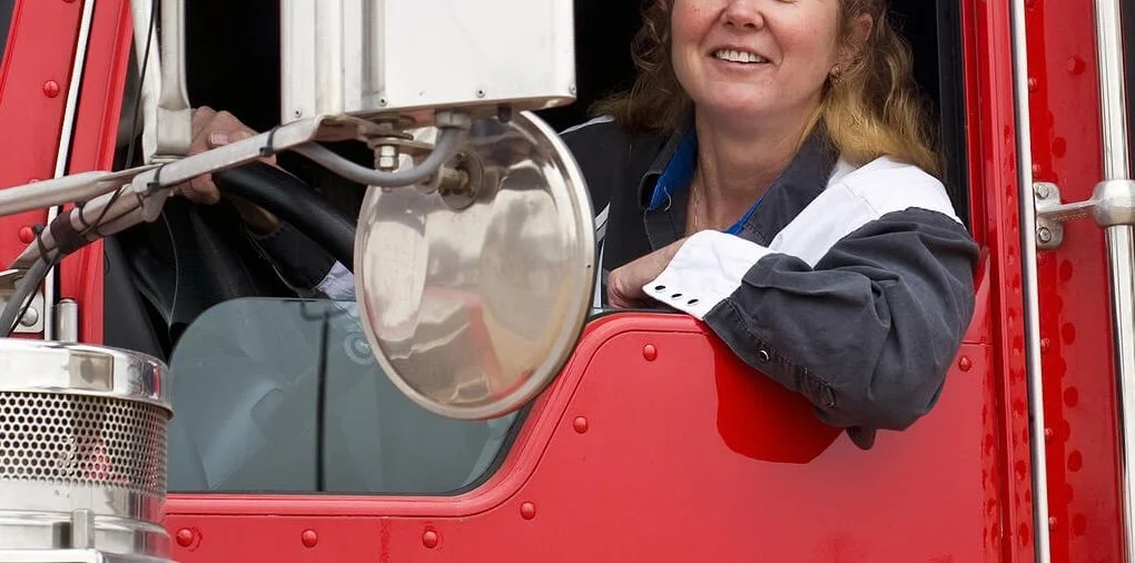 Female commercial truck driver seated confidently in her vehicle after completing a SAP evaluation. SAP evaluations in New Mexico help drivers work with a qualified substance abuse professional to rebuild confidence and move forward with clarity.