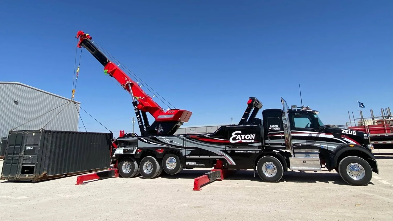 Eaton Road Solutions rotator handling a shipping container