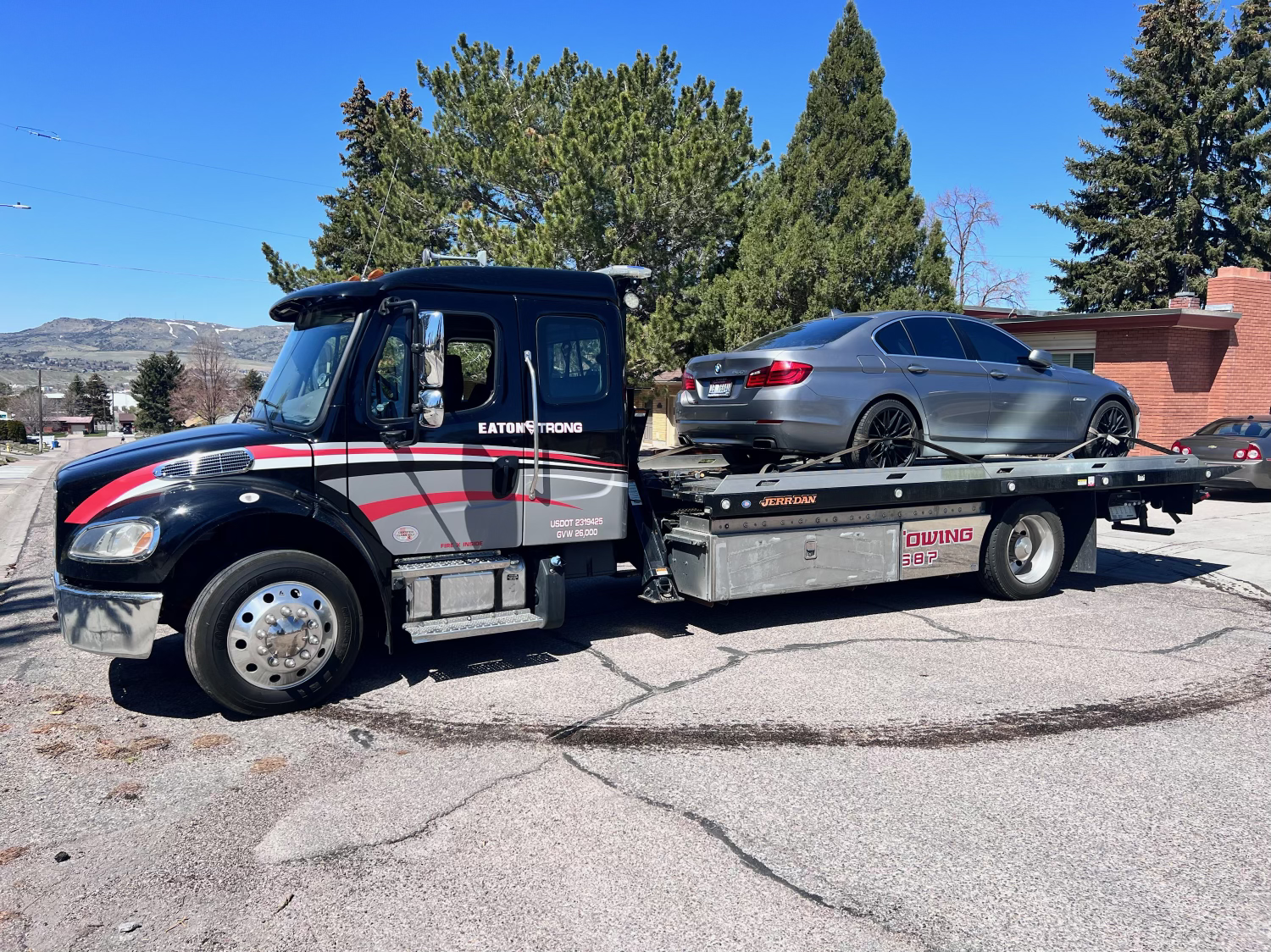 Eaton Road Solutions flatbed tow truck providing vehicle towing service