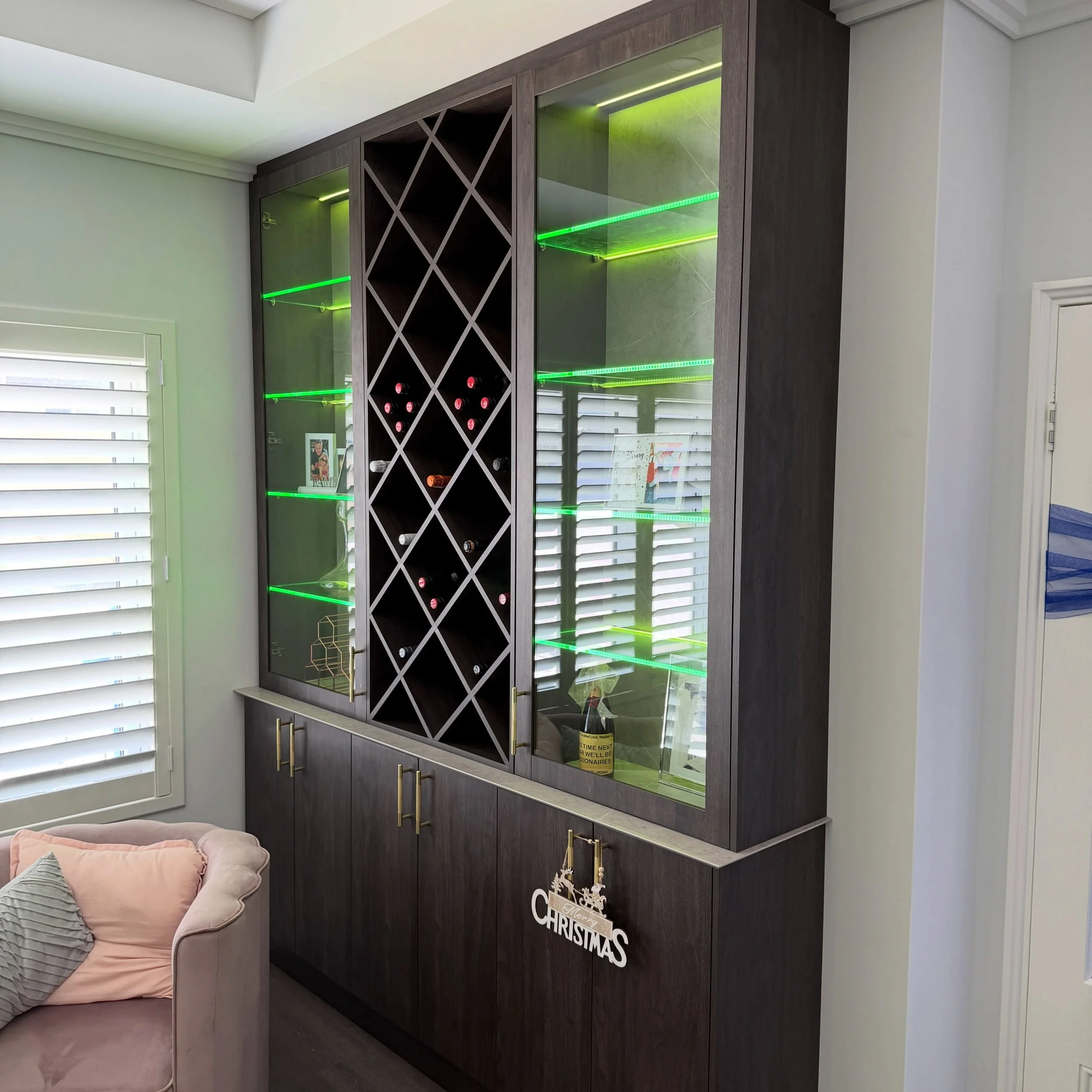 Custom Wine Area 2 in Mindarie 

- Custom Glass Doors 
- Custom Glass Shelves 
- @blumaustralia hinges 
- @hafele_aus RGB lighting 
- Custom Wine Rack 
- @polytec Xenolith Tops &amp; Splashback

Designed, manufactured &amp; installed by @evogeninteri