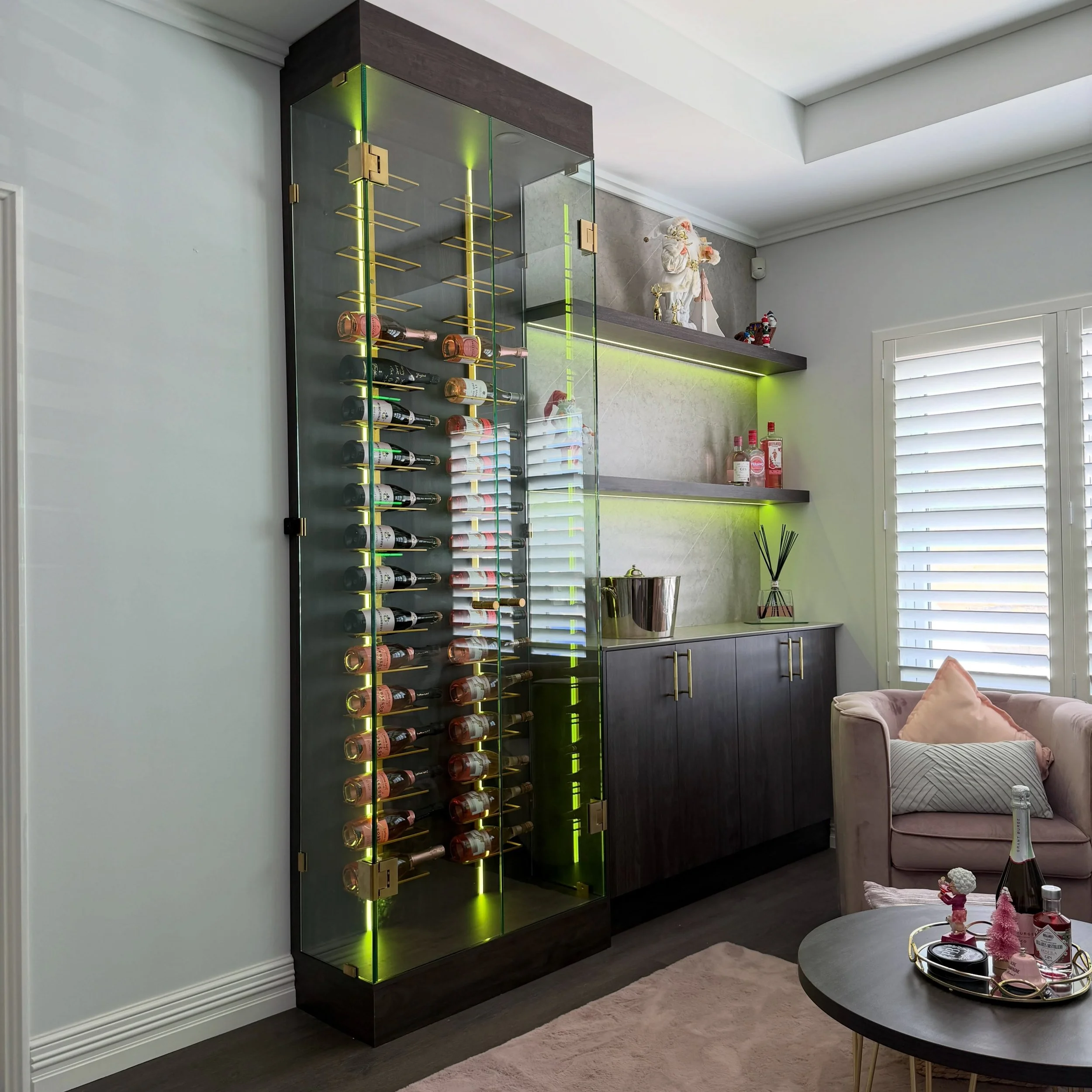 Custom Wine Area in Mindarie 

- Custom Glass Doors 
- @forgehardware_melbourne Brass Glass Door Hinges 
- @hafele_aus RGB lighting 
- Custom Brass Wine Racks 
- @polytec Xenolith Tops &amp; Splashback

Designed, manufactured &amp; installed by @evog