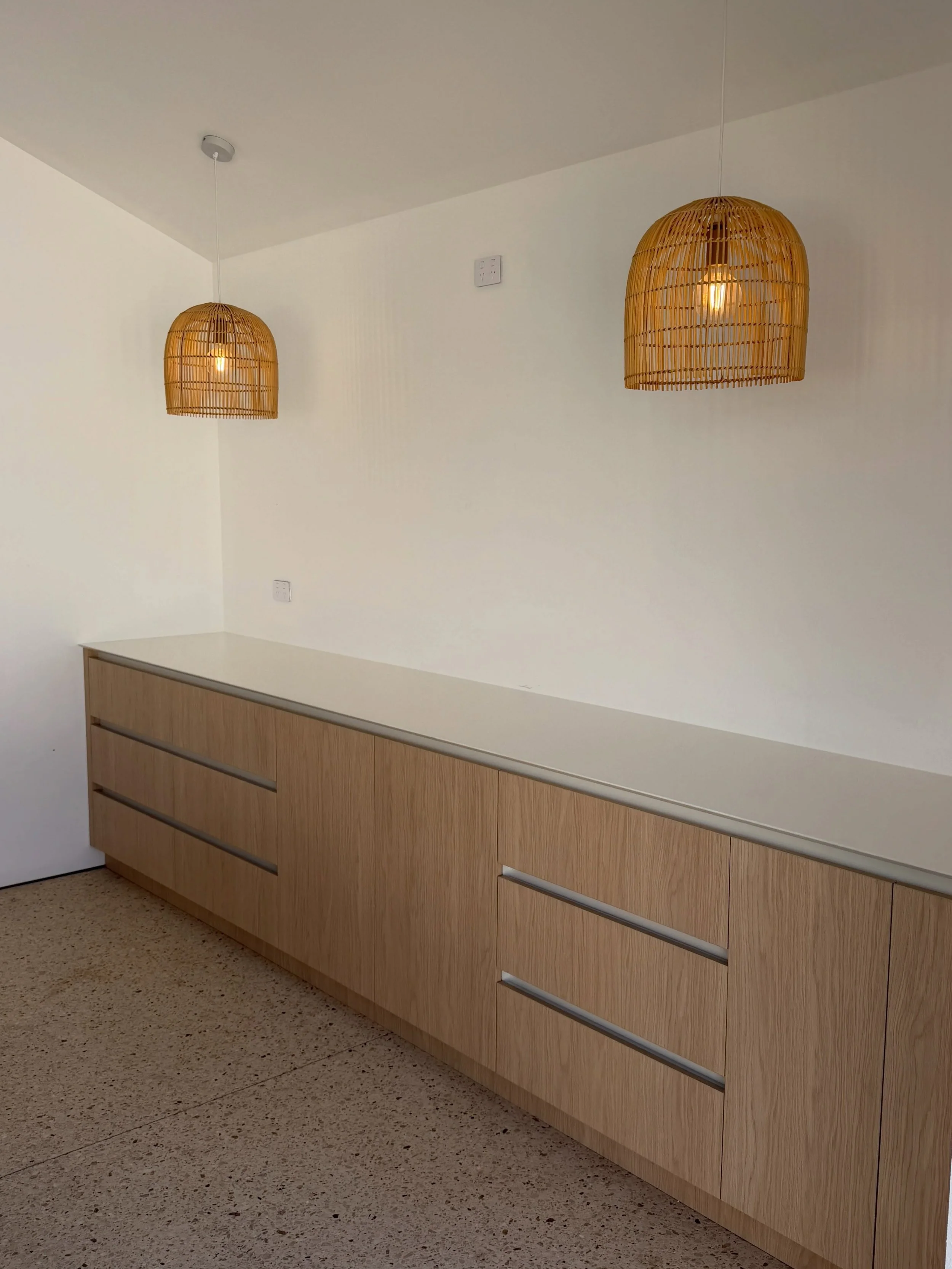 Pool House Cabinetry 

- @polytec Blonde Oak doors &amp; drawer fronts 
- @polytec Xenolith White benchtops with sharknose detailing 
- Shadowline finger grips for doors &amp; drawers 
- Undermount sink 
- Integrated fridge 

Designed, manufactured &