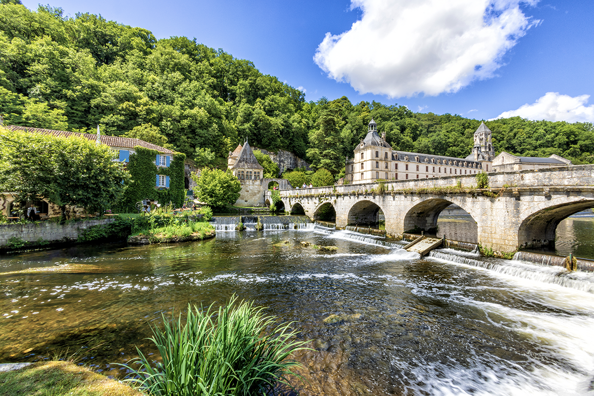 Scenic view of a historic stone bridge over the river in Brantôme in the Dordogne