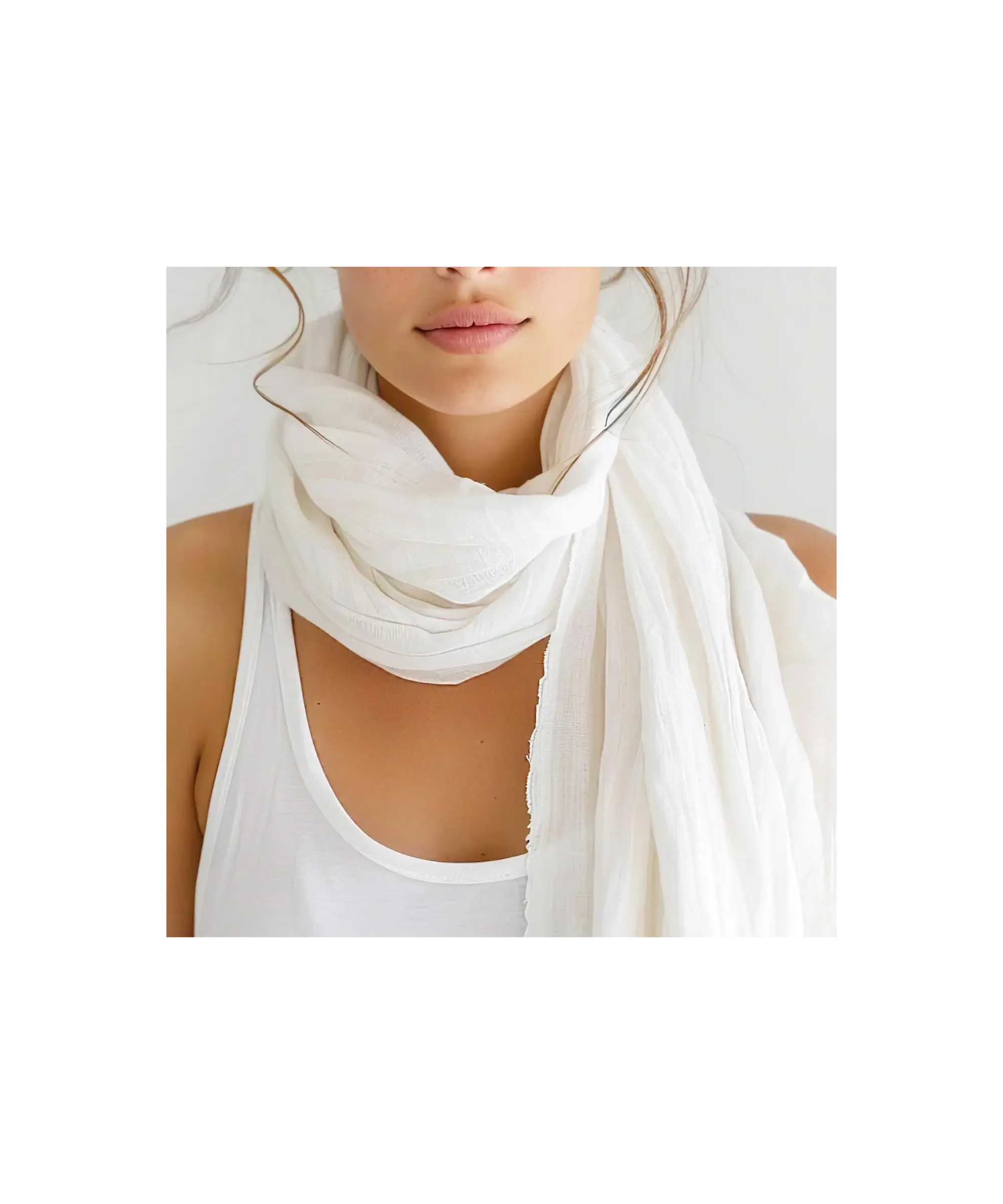 Lightweight white linen scarf softly wrapped around the neck, styled with a simple tank top for an airy, effortless capsule wardrobe look.