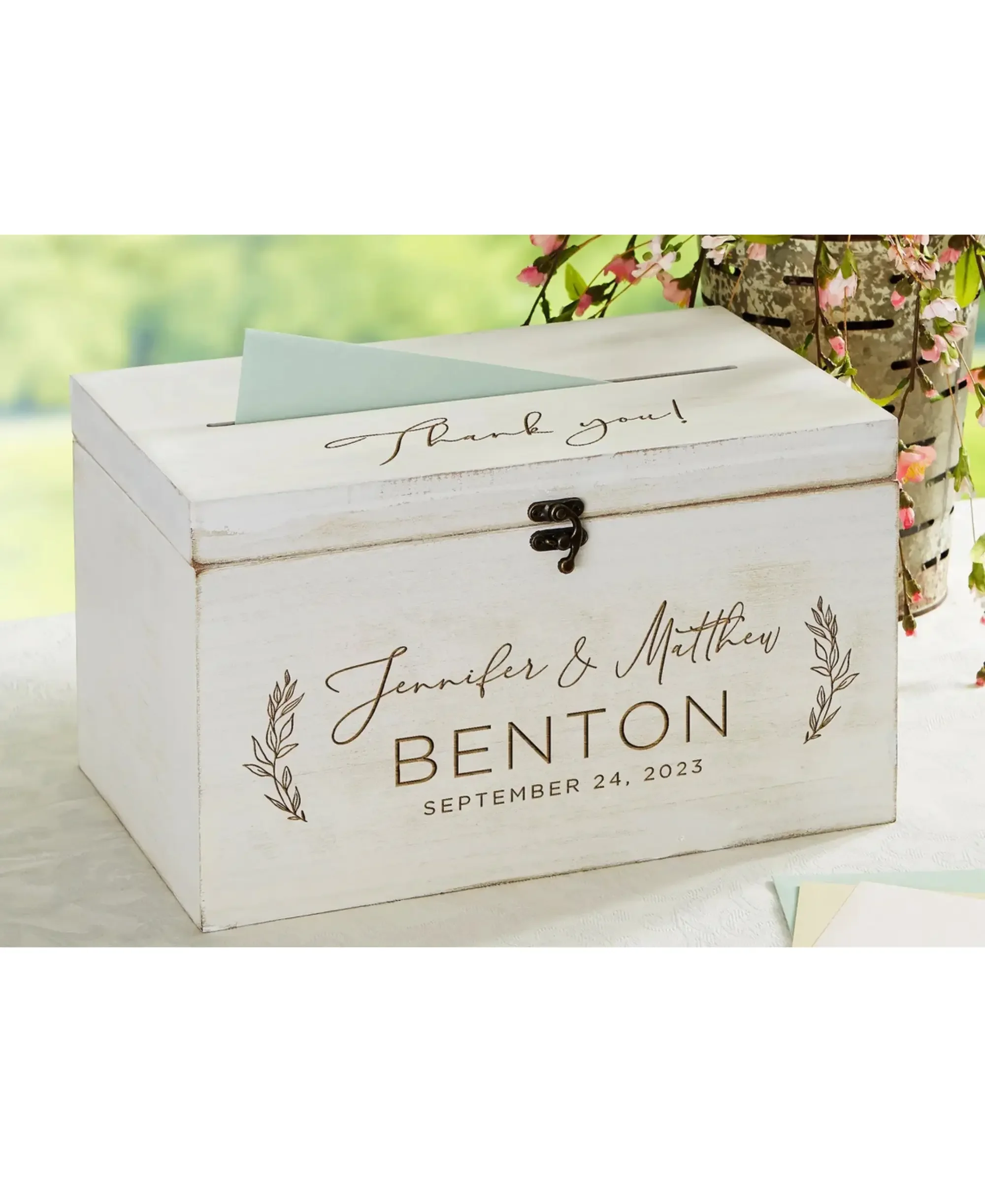 Personalized wooden wedding keepsake box with engraved names and wedding date.