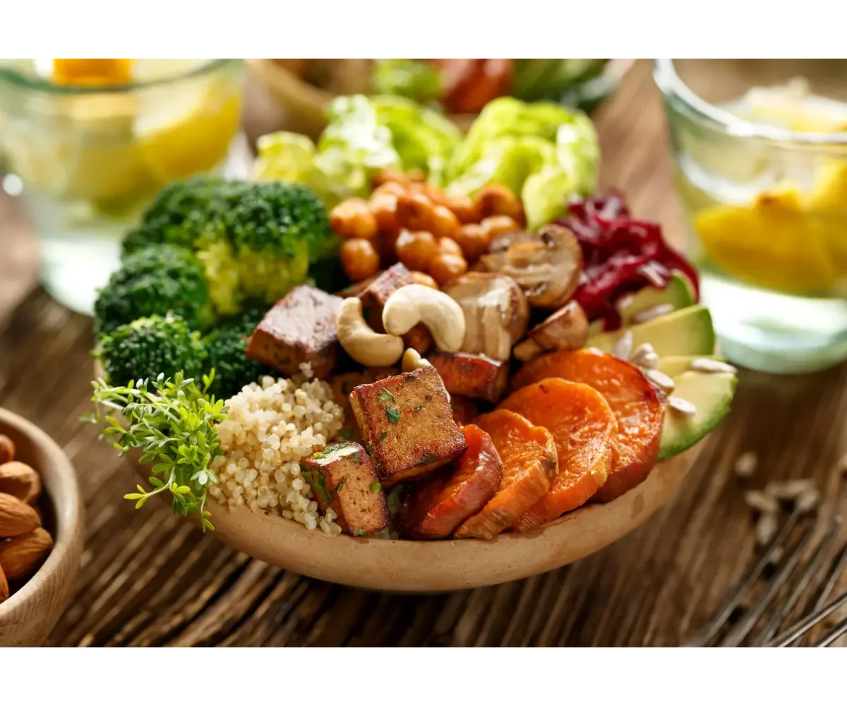 a plate with colorful veggies and nuts