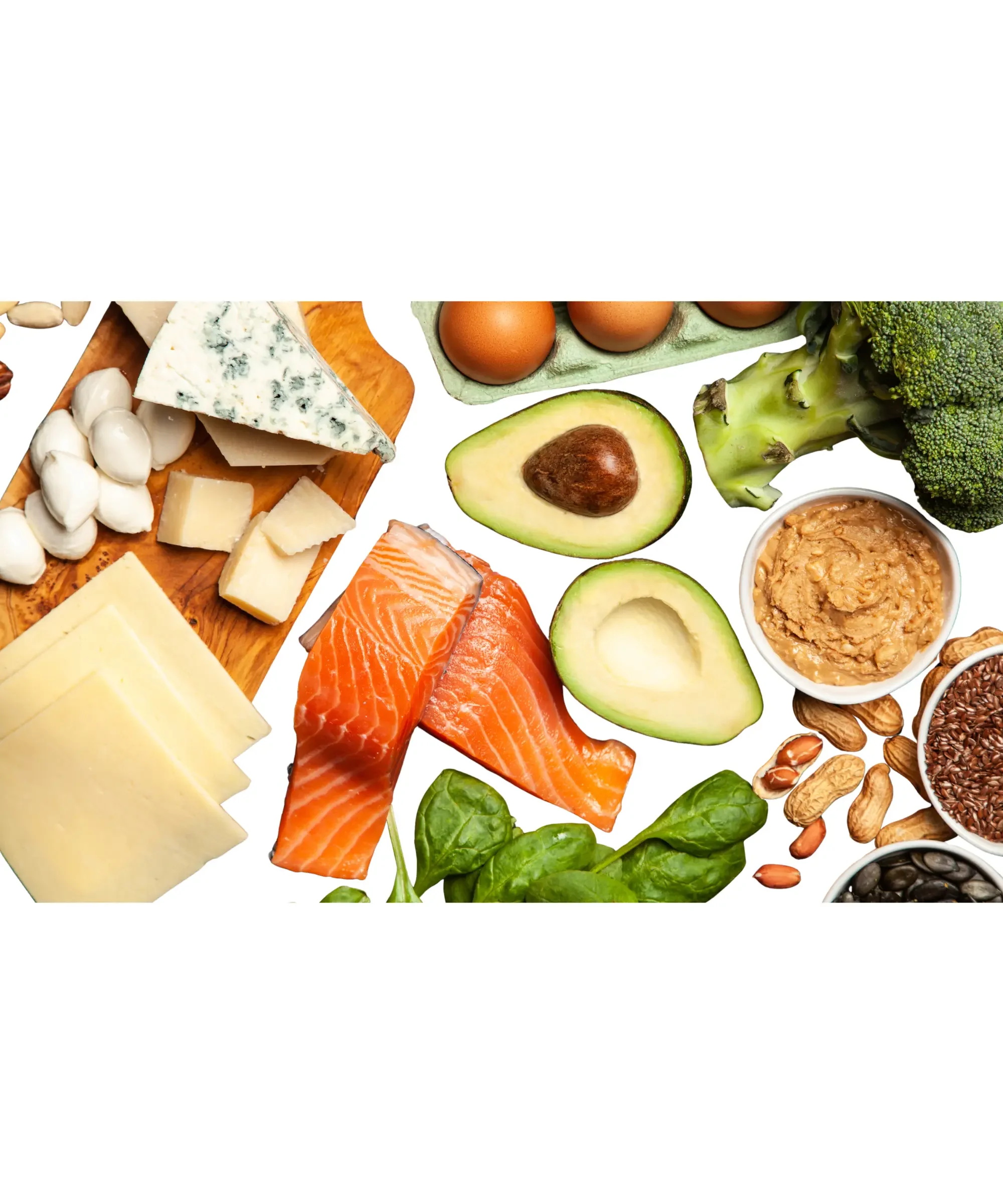 Healthy low-carb foods including salmon, avocado, eggs, nuts, cheese, and vegetables arranged together.