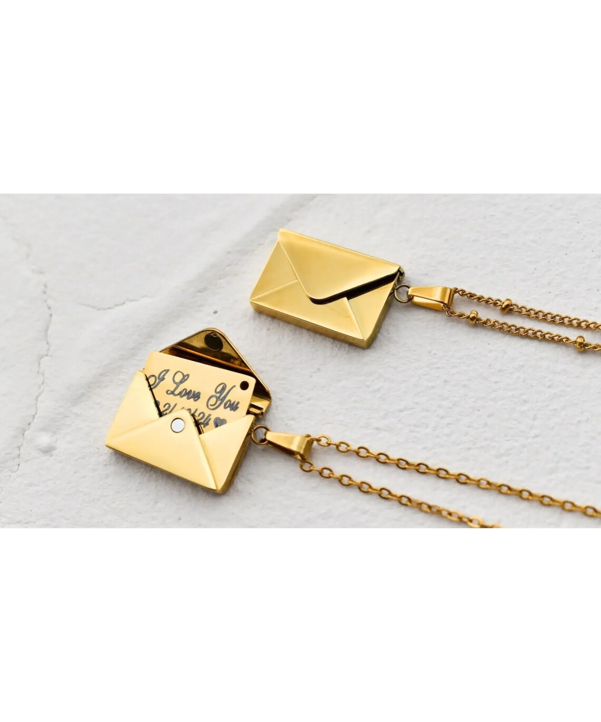 Gold envelope locket necklace with hidden message inside.