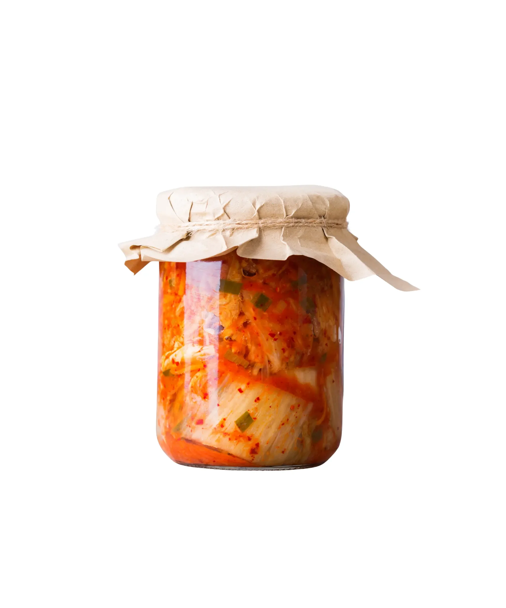 Glass jar of homemade fermented vegetables (kimchi) with cabbage, chili, and herbs—probiotic-rich preserved food, ideal for home fermentation, gut health, and small-batch food business