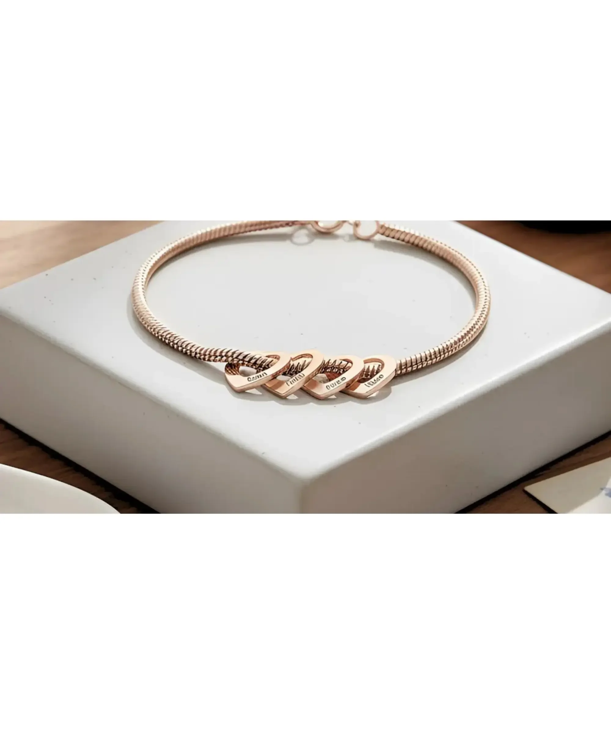 Personalized rose gold charm bracelet with engraved heart pendants featuring children’s names, meaningful gift for mom or grandmother.
