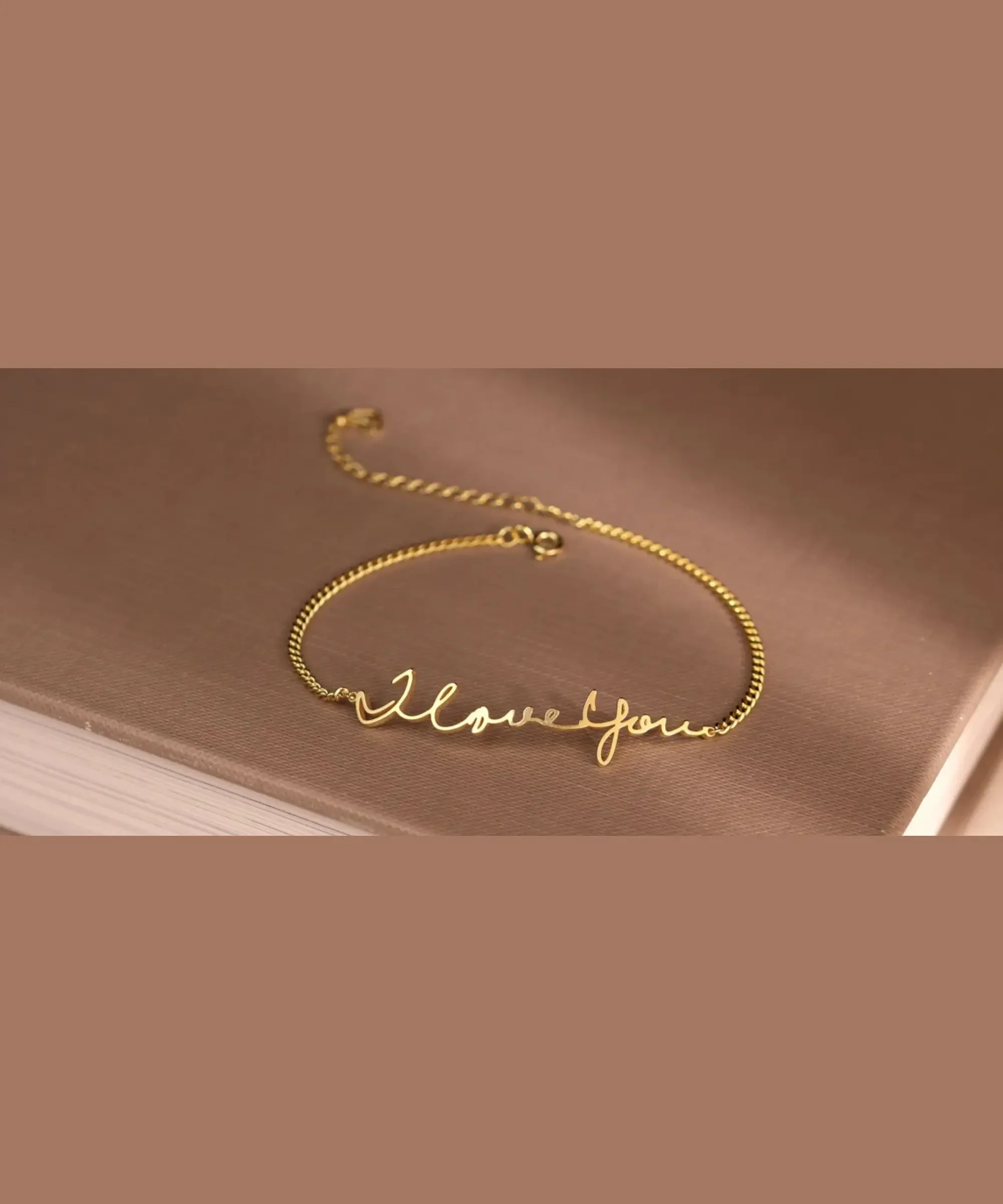 Personalized handwriting bracelet in gold with custom message.