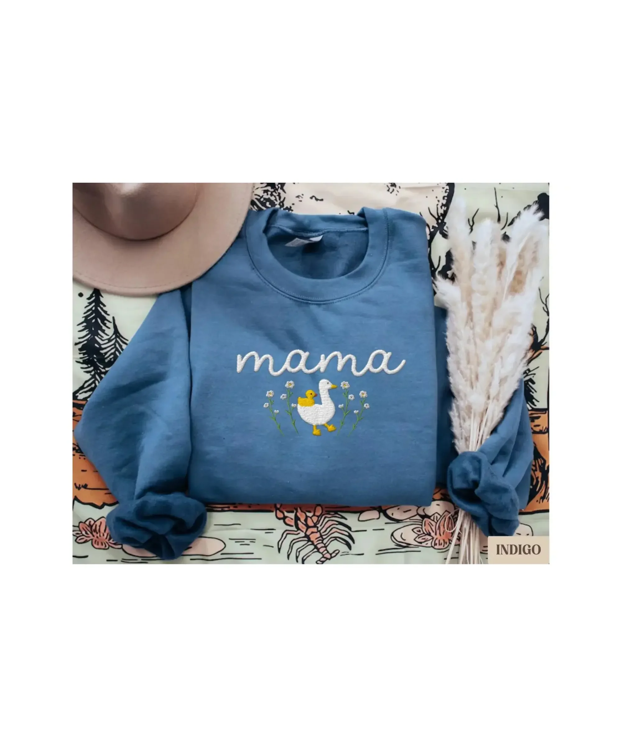 Blue embroidered “Mama” sweatshirt with duck and flowers design, cozy Mother’s Day gift idea for moms.