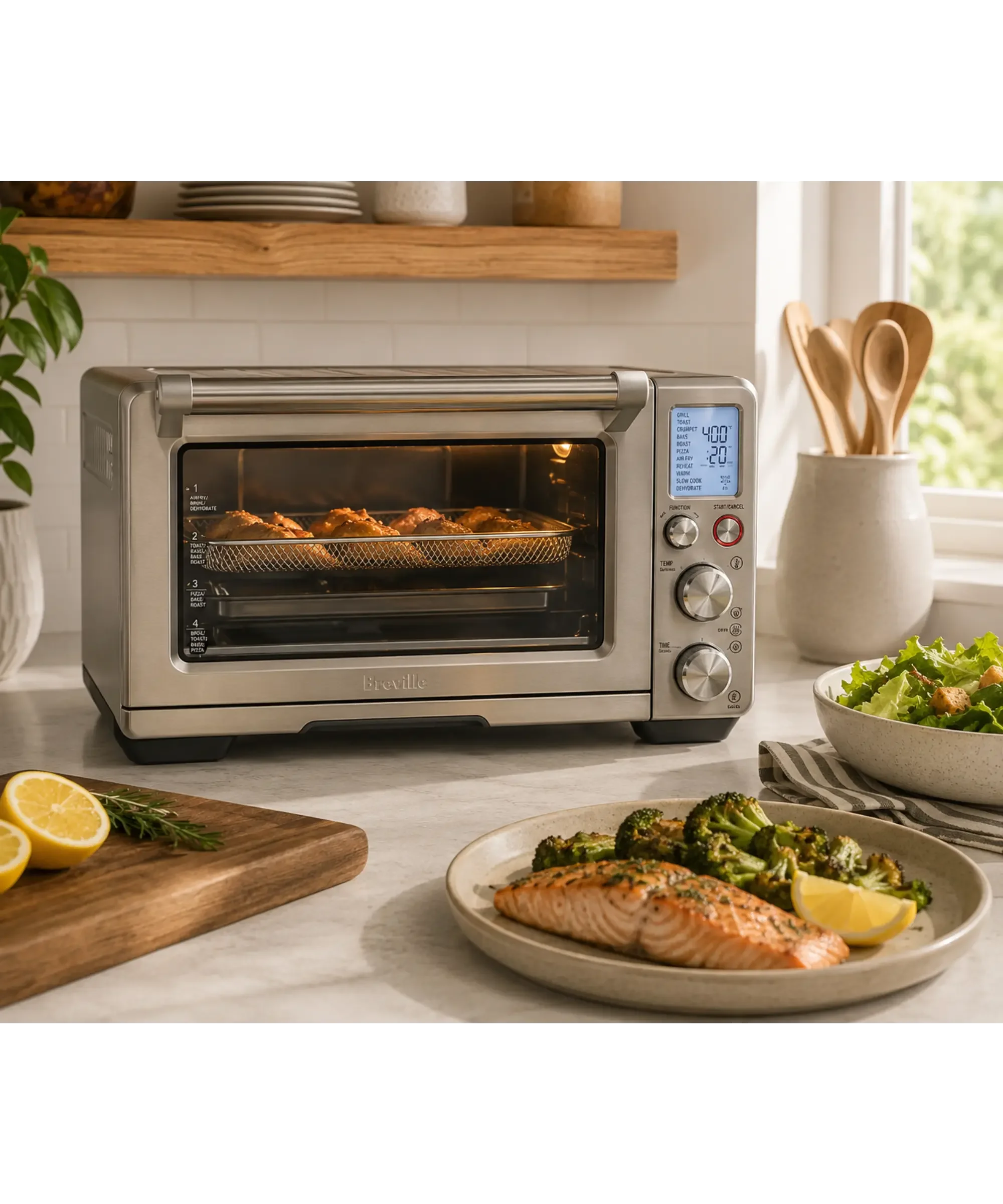 Stainless steel Breville Smart Oven Air Fryer Pro on a bright kitchen countertop with roasted vegetables, salmon, fresh greens, and natural wood accents, highlighting its spacious countertop oven design and versatile cooking functions.