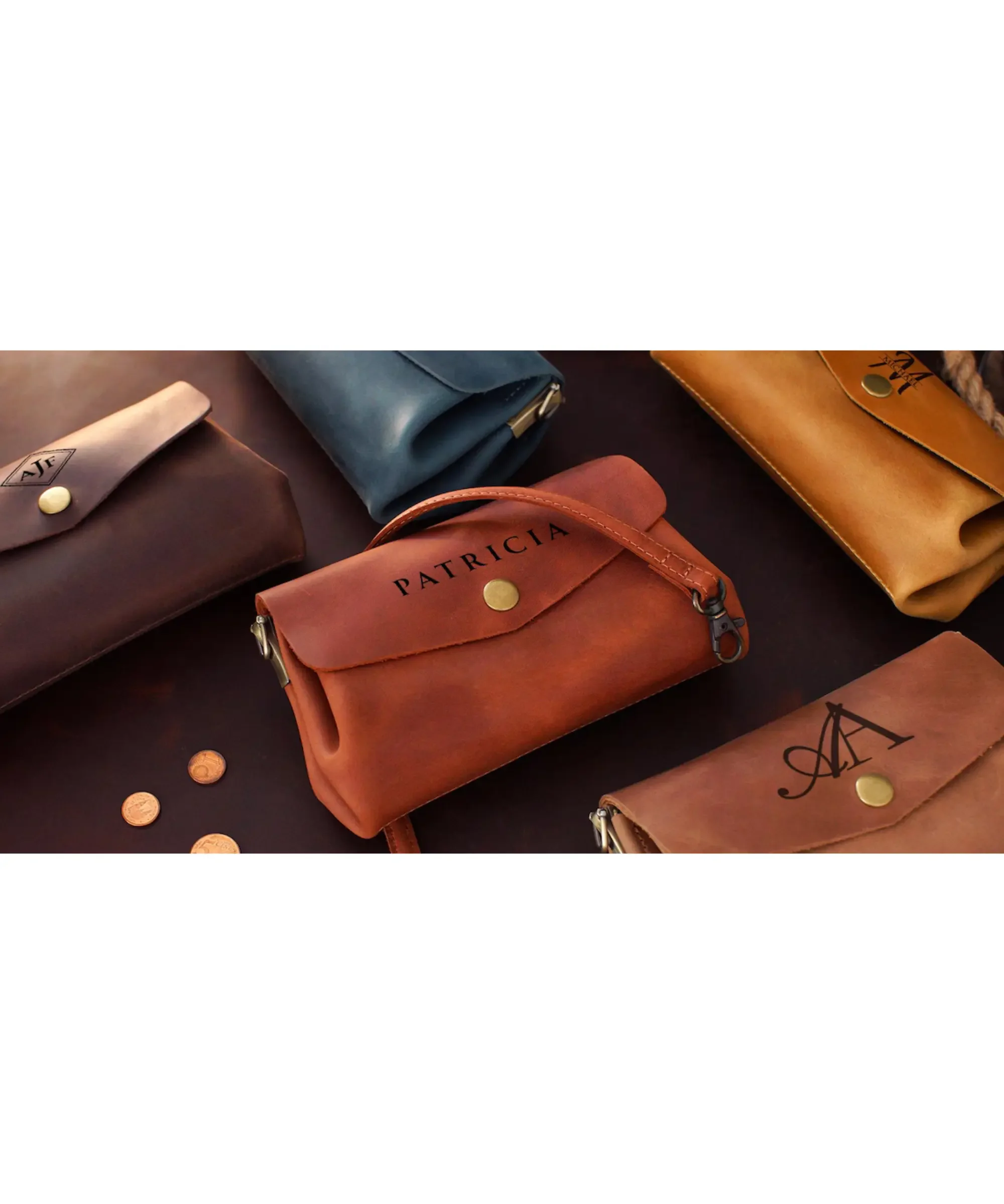 Personalized minimalist leather crossbody bags in multiple colors with engraved names and initials, compact custom mini shoulder purses displayed on a table.
