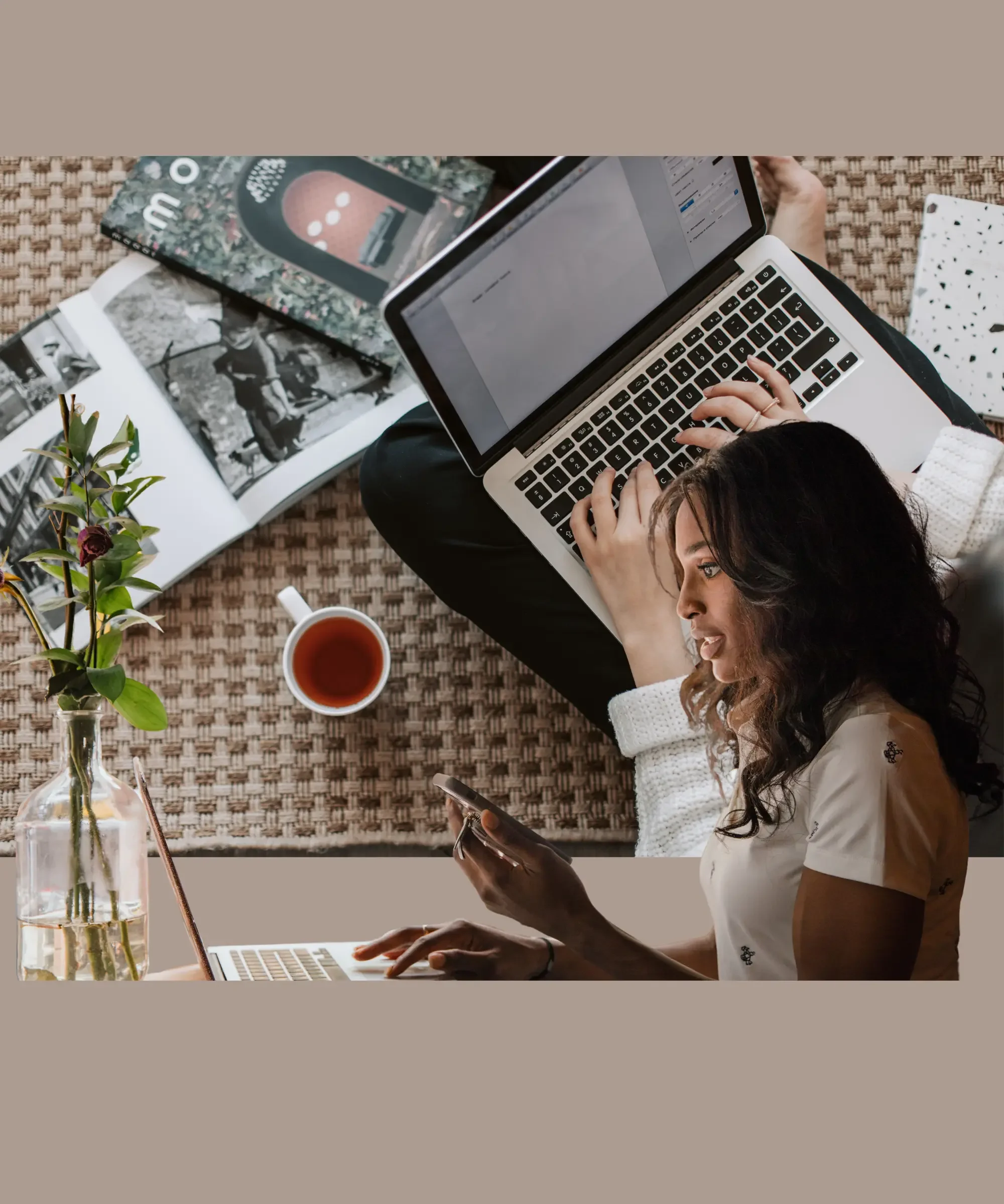 Woman using laptop and phone to manage daily tasks, illustrating how people use AI as a personal life manager.