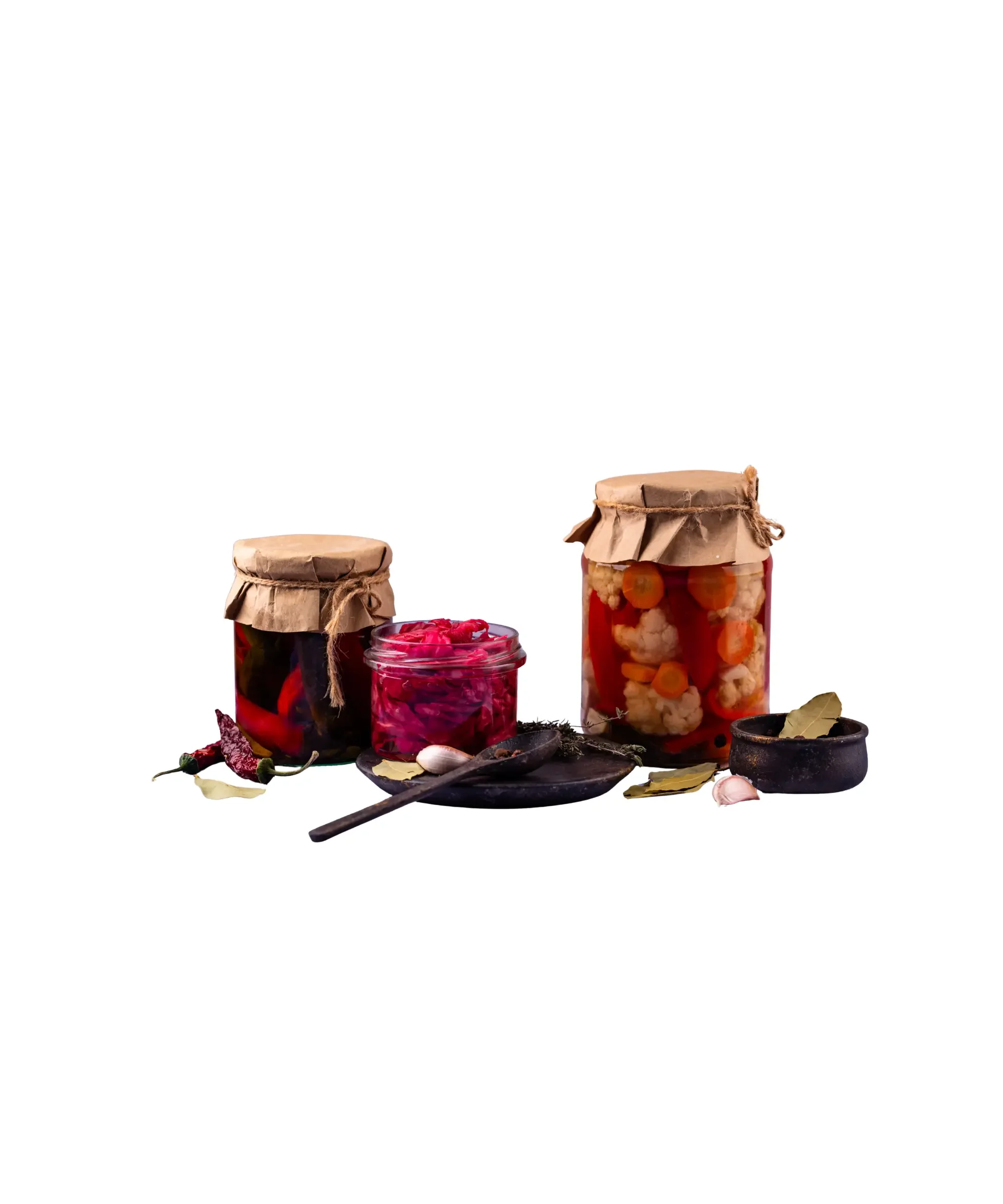 Assorted jars of homemade fermented vegetables and pickles with spices—small-batch preserved foods like sauerkraut, pickled cabbage, and cauliflower, ideal for gut health, home fermentation, and selling artisanal products