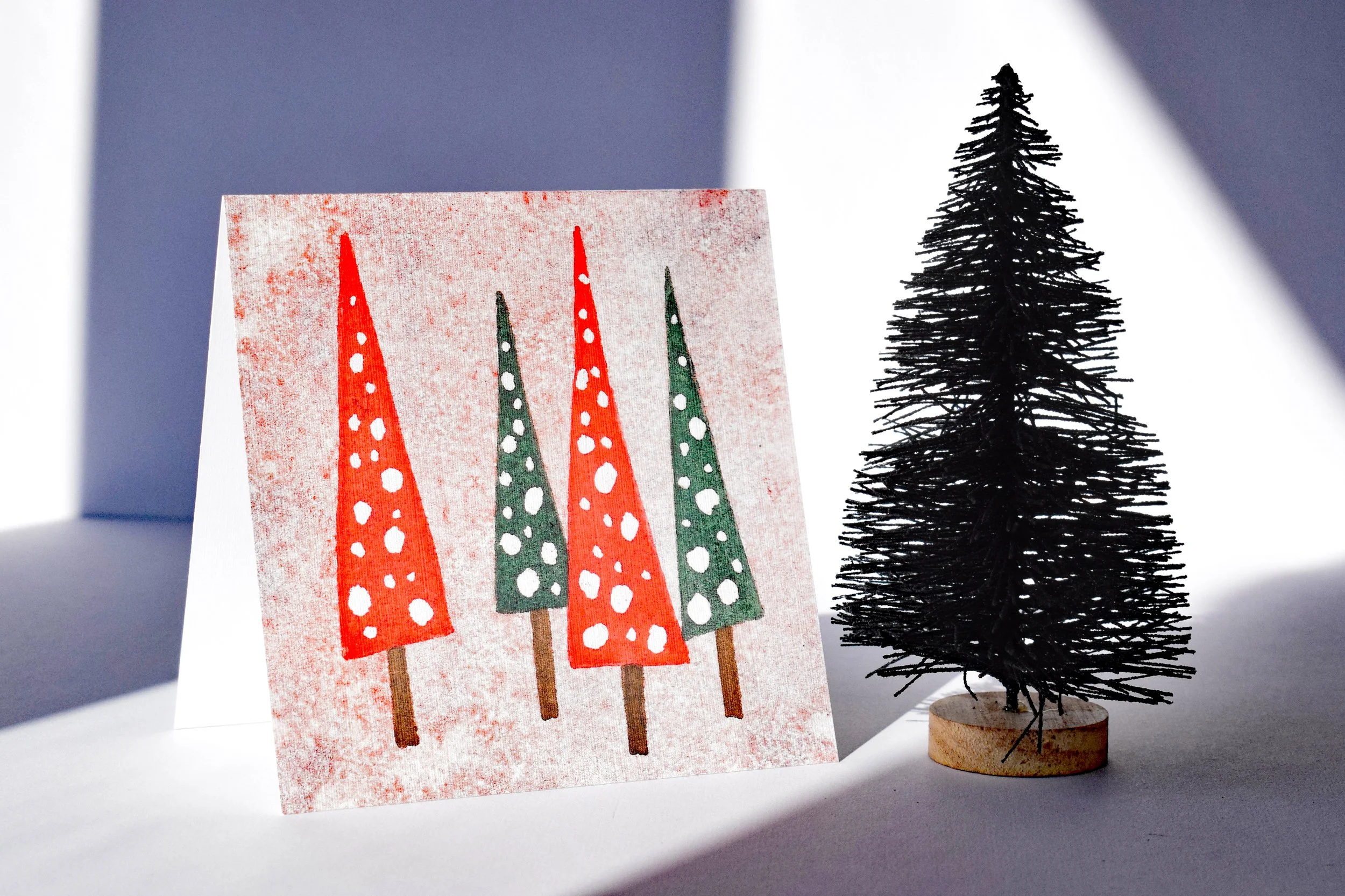 Red background Xmas trees front.jpg