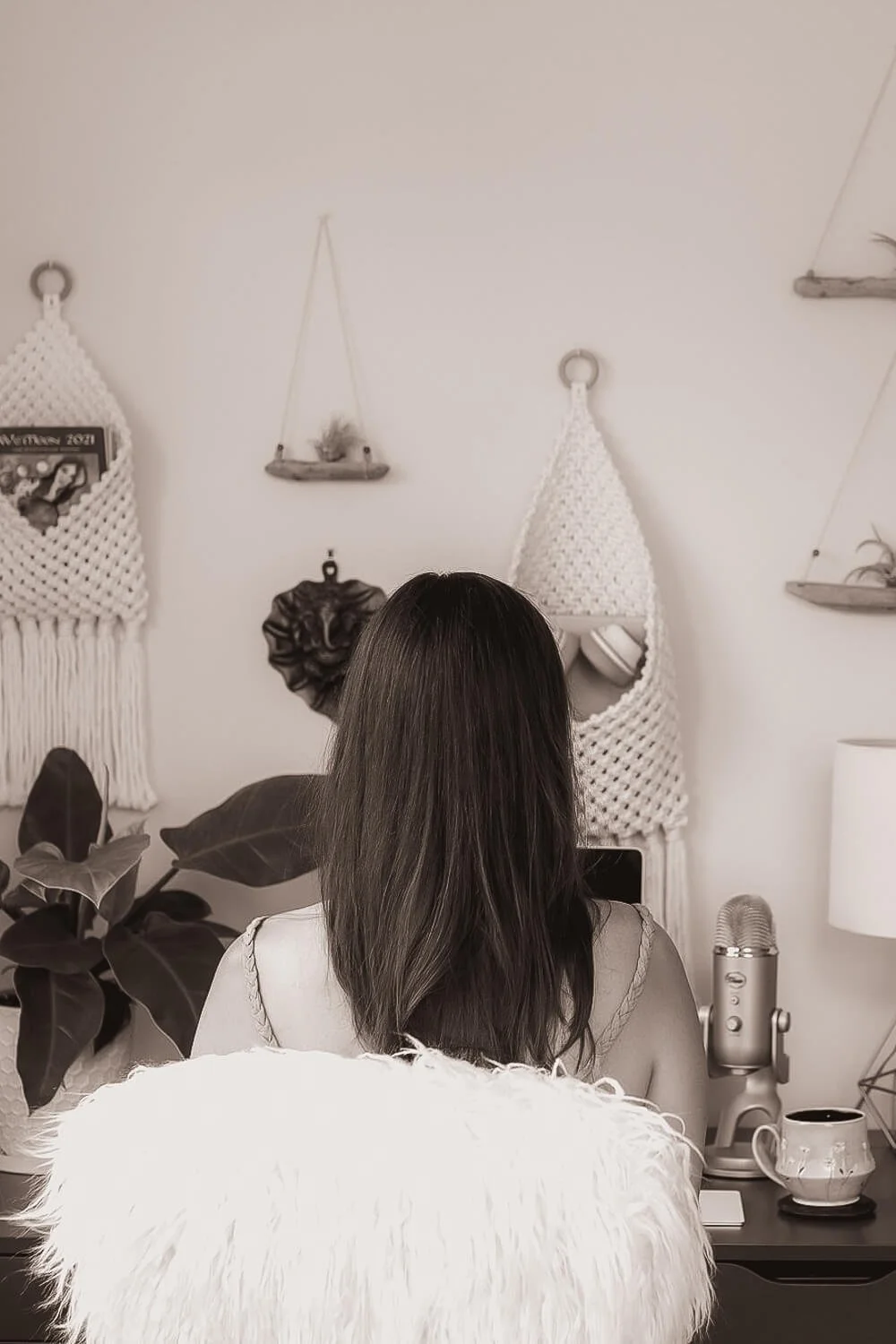 Kristi Amdahl sitting at her desk and building a One Week website for a client