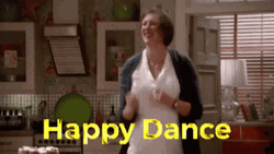 Miranda Hart doing an exuberant happy dance, illustrating post-submission celebration.