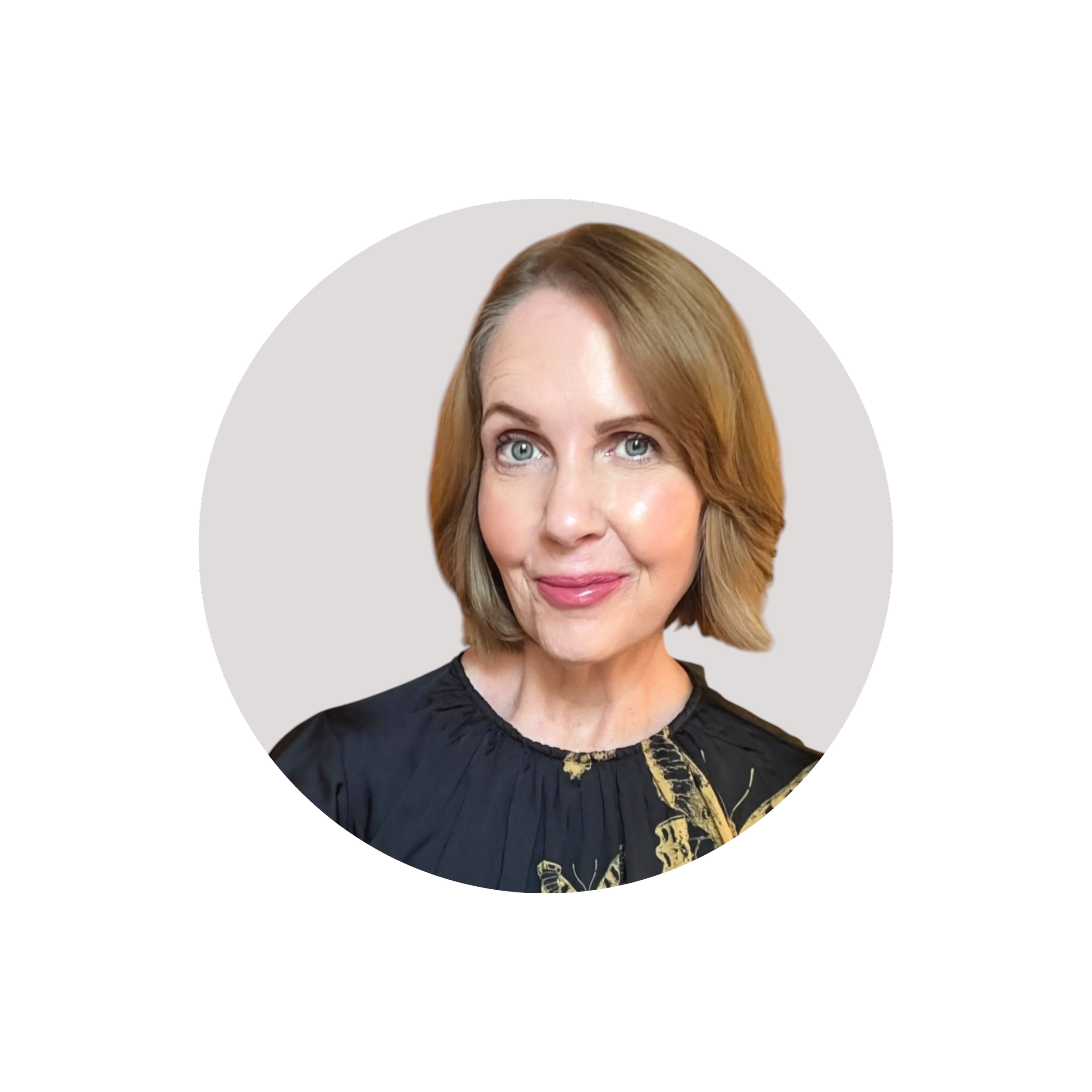 Headshot of Lori Massicot, a woman with short blonde hair wearing a dark top, host of the To 50 and Beyond podcast for midlife women exploring alcohol-free living.